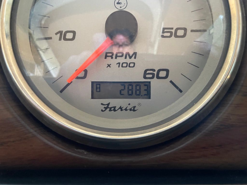 Close-up of a tachometer showing 288.3 RPM.
