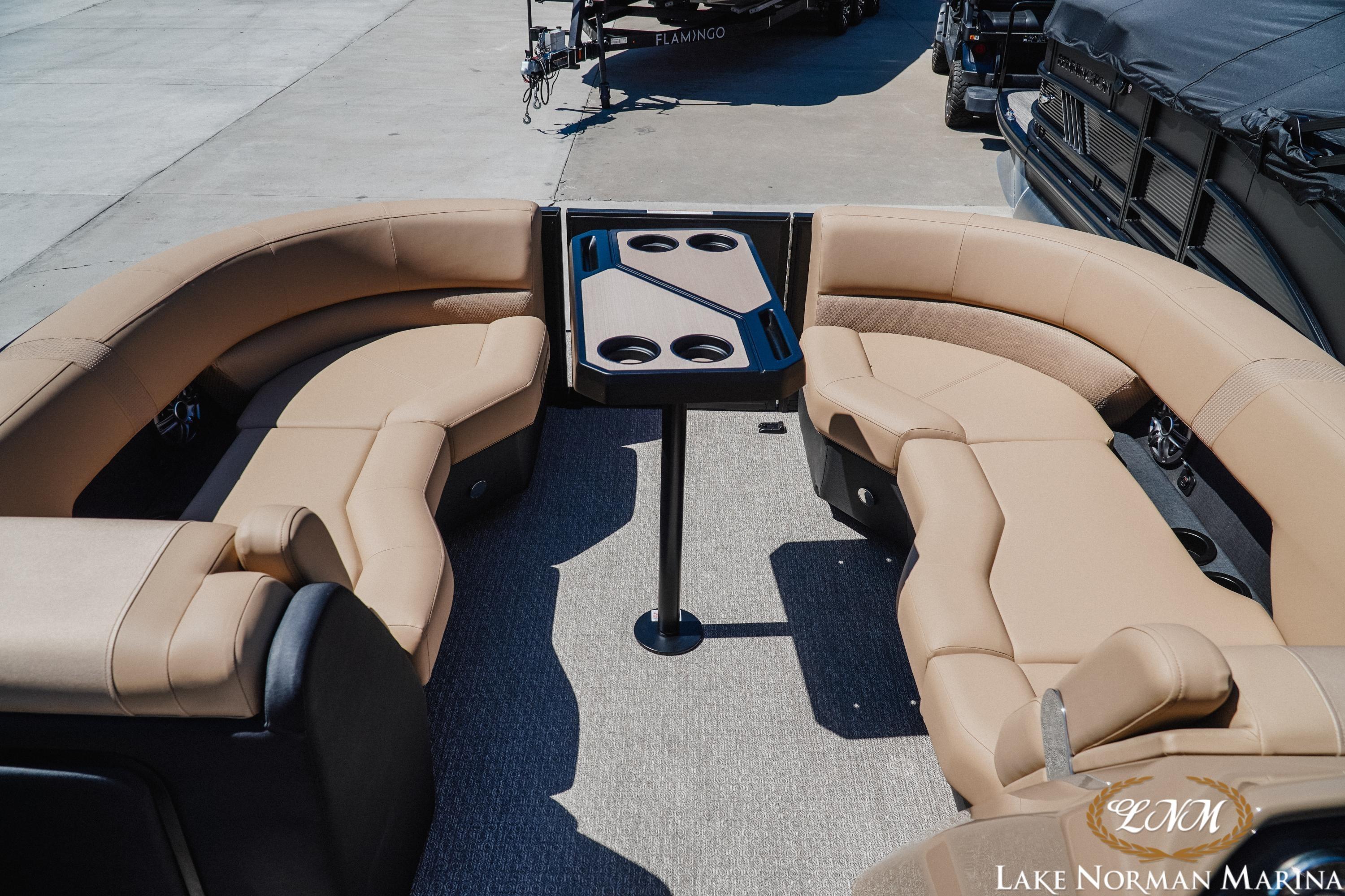 Luxurious seating area on 2026 Evotti 523CS boat at Lake Norman Marina.