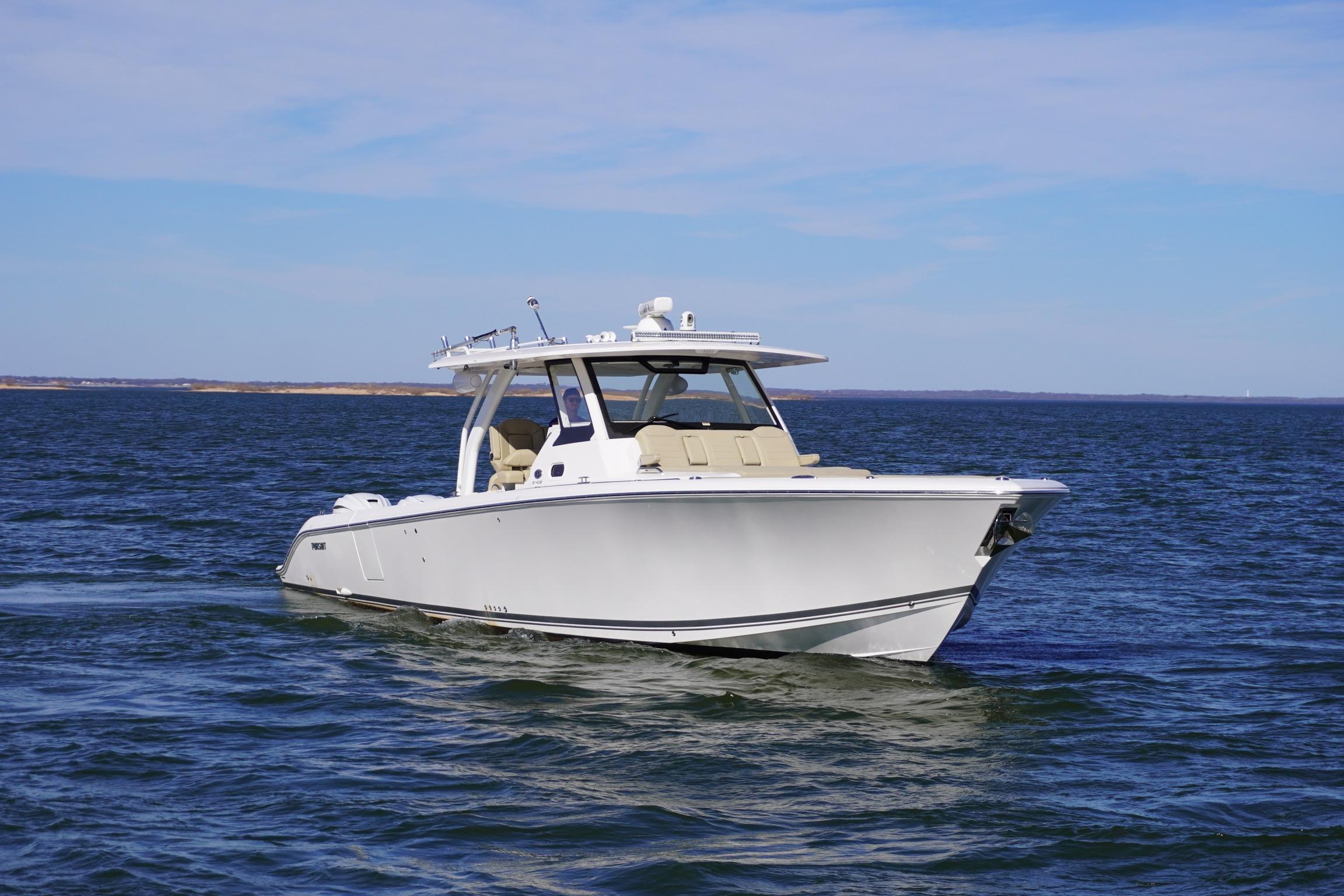 2019 Pursuit S 408 Sport boat cruising on open water under clear skies.