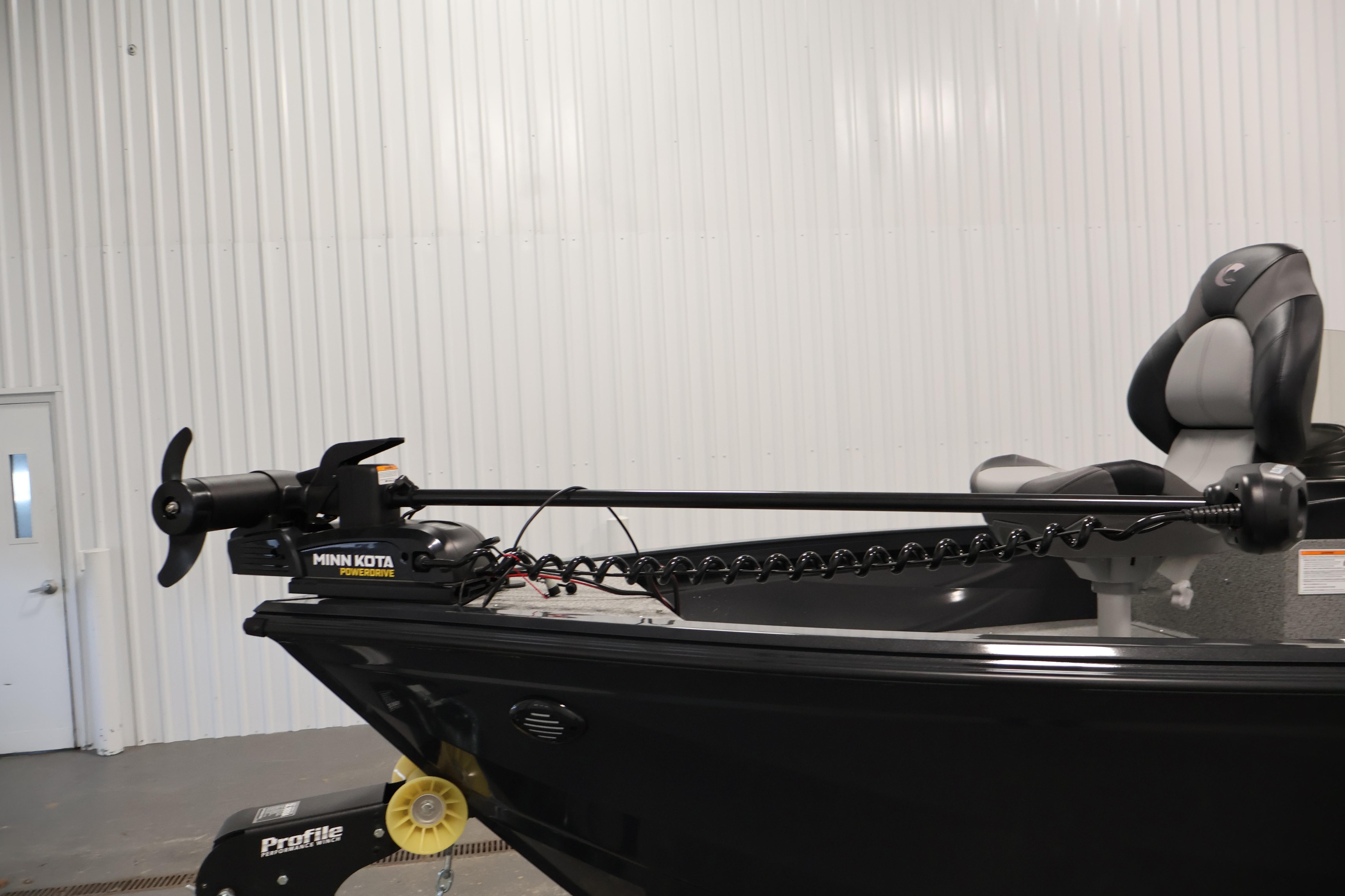 2026 Crestliner 1850 Kodiak SC boat with Minn Kota trolling motor in a showroom.