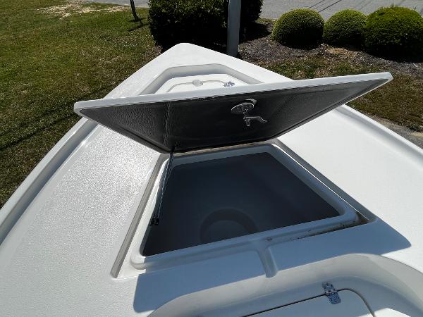 2024 Key West 188 Bay Reef boat with open storage compartment.
