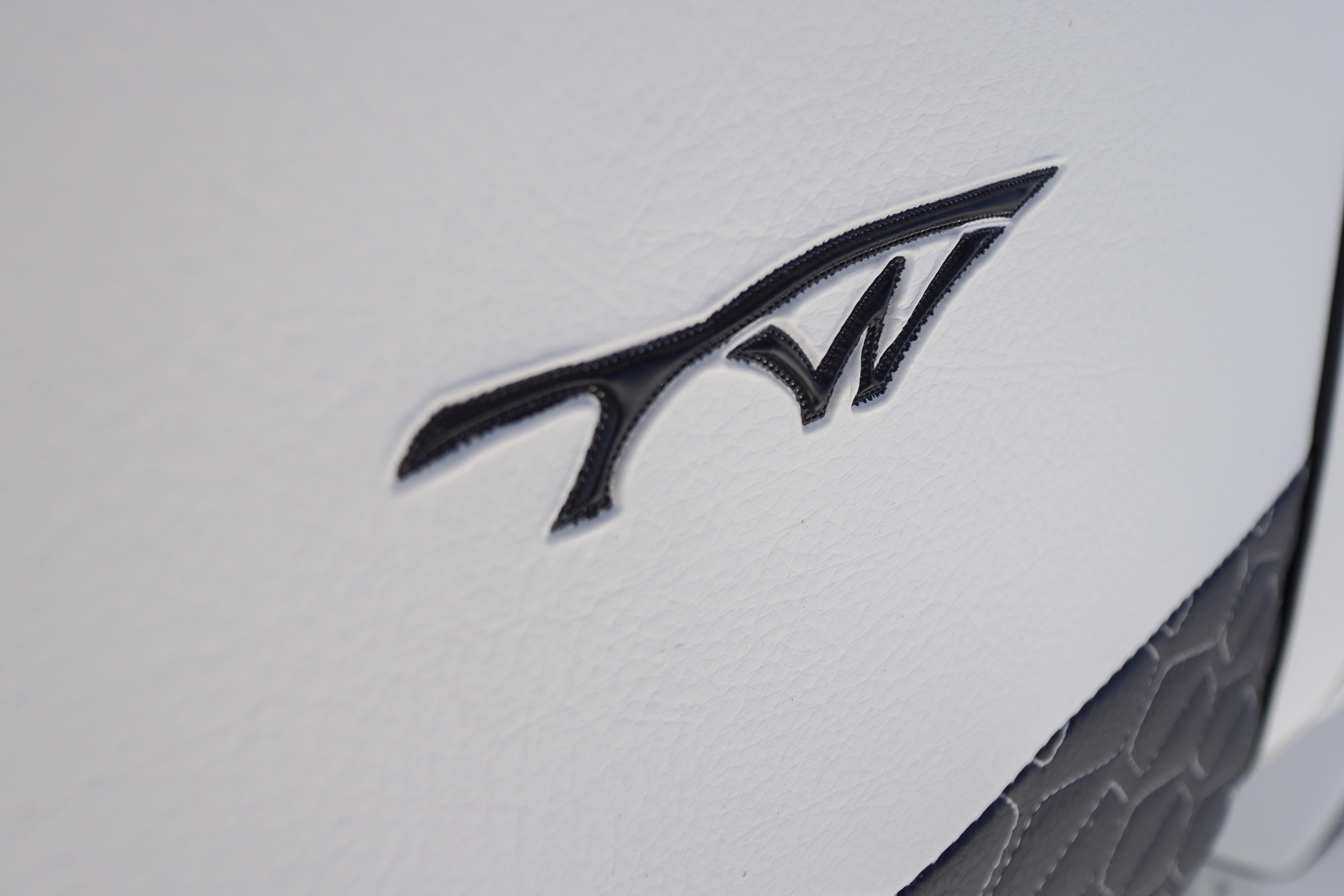 Close-up of Tidewater 220 CC Adventure 2026 logo on white surface.