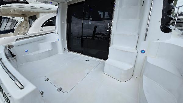2000 Carver 450 Voyager Pilothouse yacht deck with stairs and sliding door.