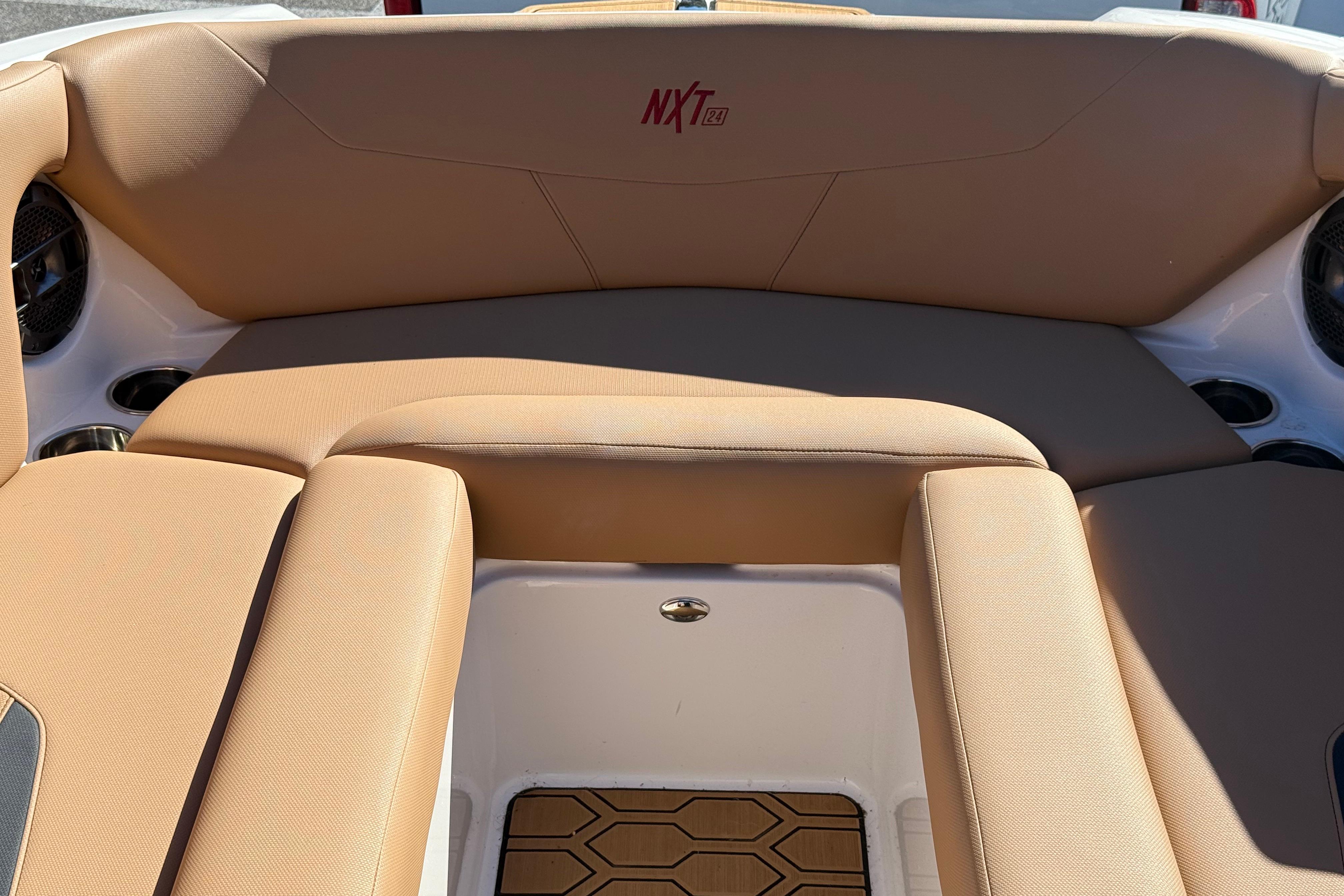 2022 MasterCraft NXT24 boat interior with tan seating and stylish design.