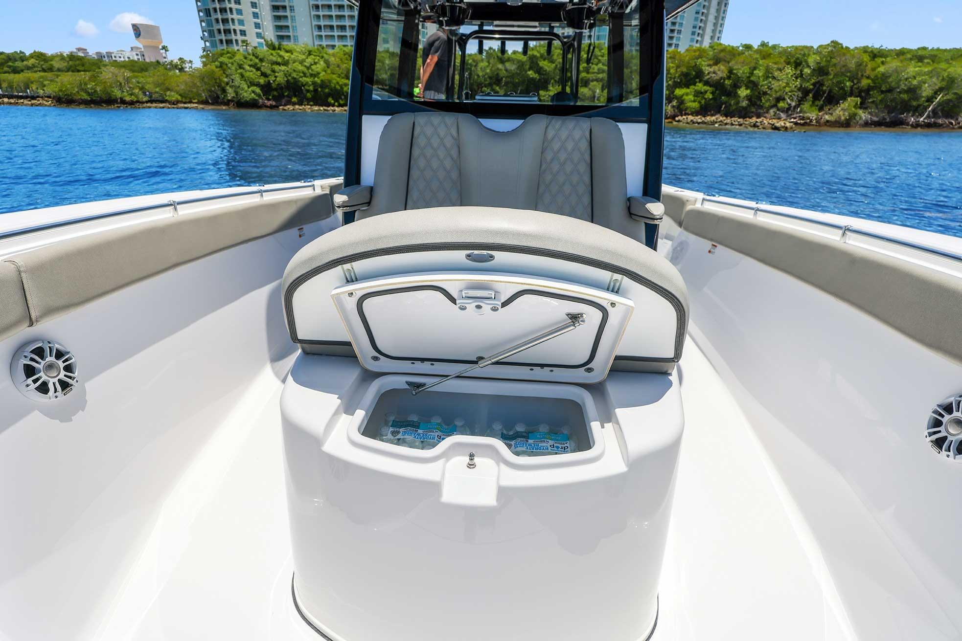 2024 Sportsman Open 352 Center Console boat interior with seating and storage compartment.