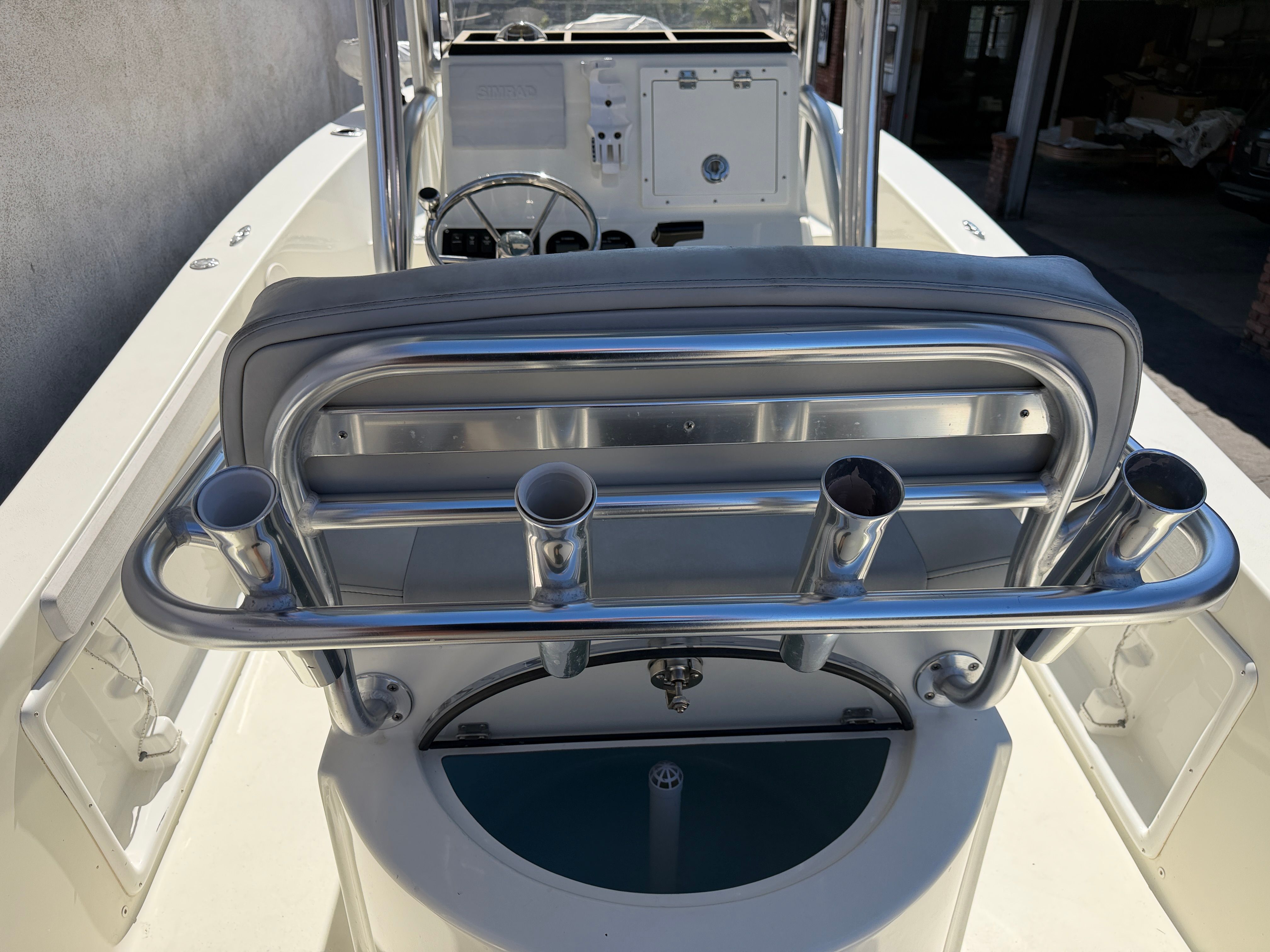KenCraft Challenger 2021 boat with rod holders and helm console.