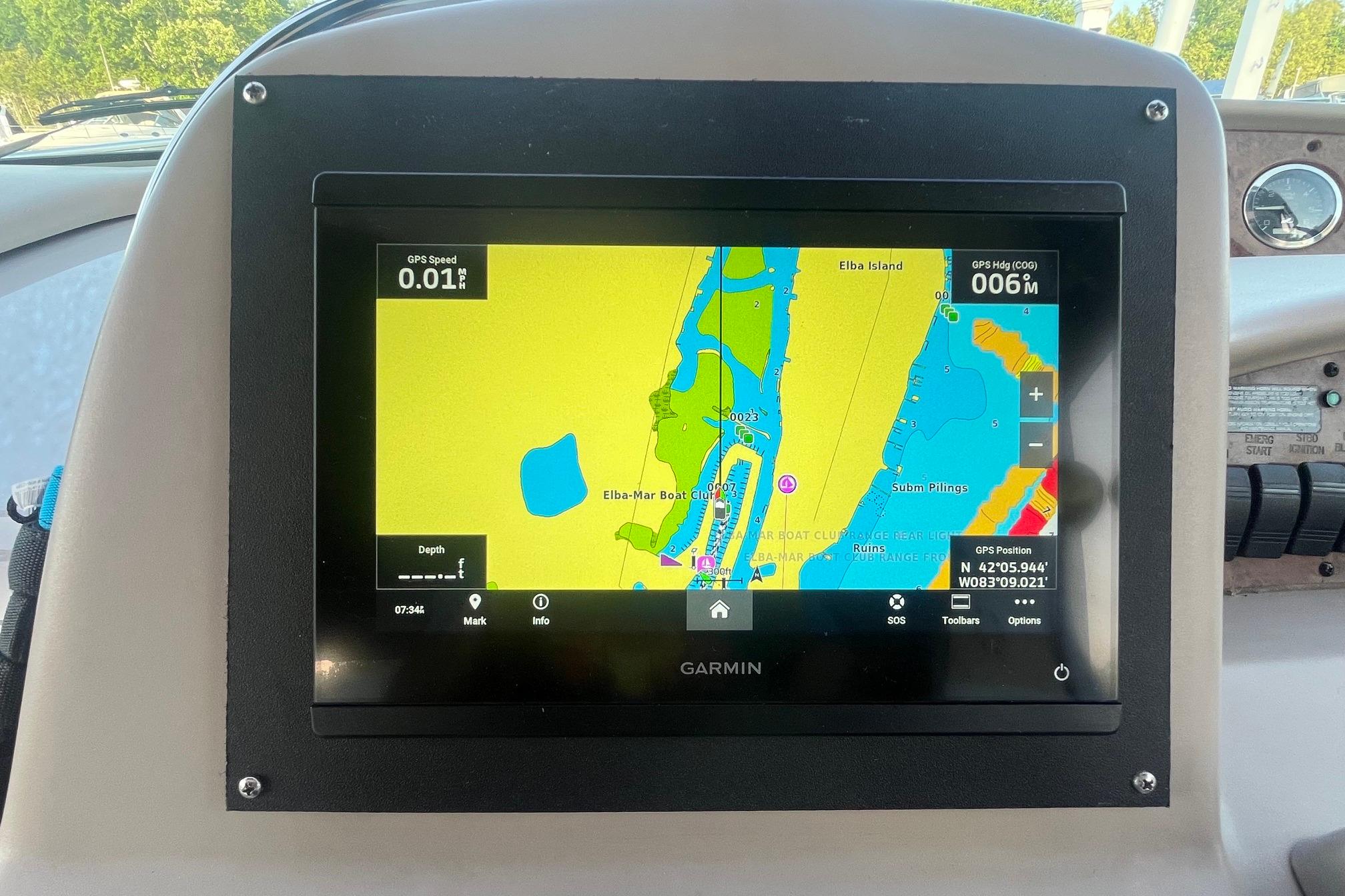 Garmin GPS display on 2001 Sea Ray 340 Sundancer showing navigation map and coordinates.