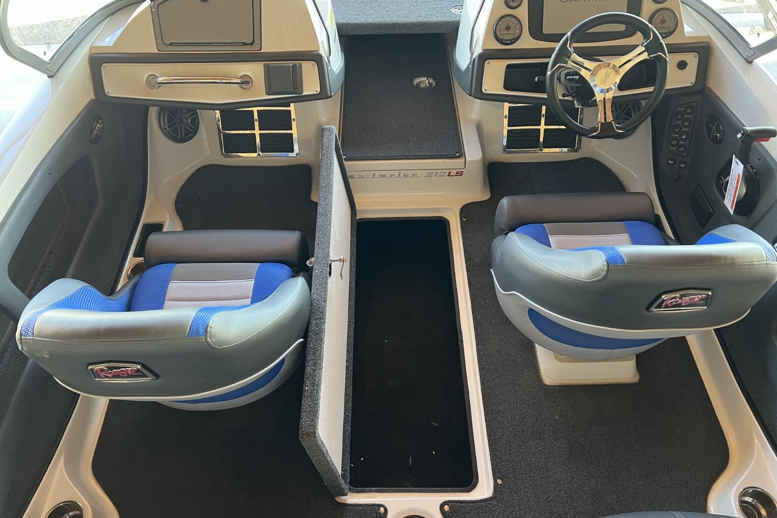 2025 Ranger 212LS boat interior with blue seats and steering wheel.