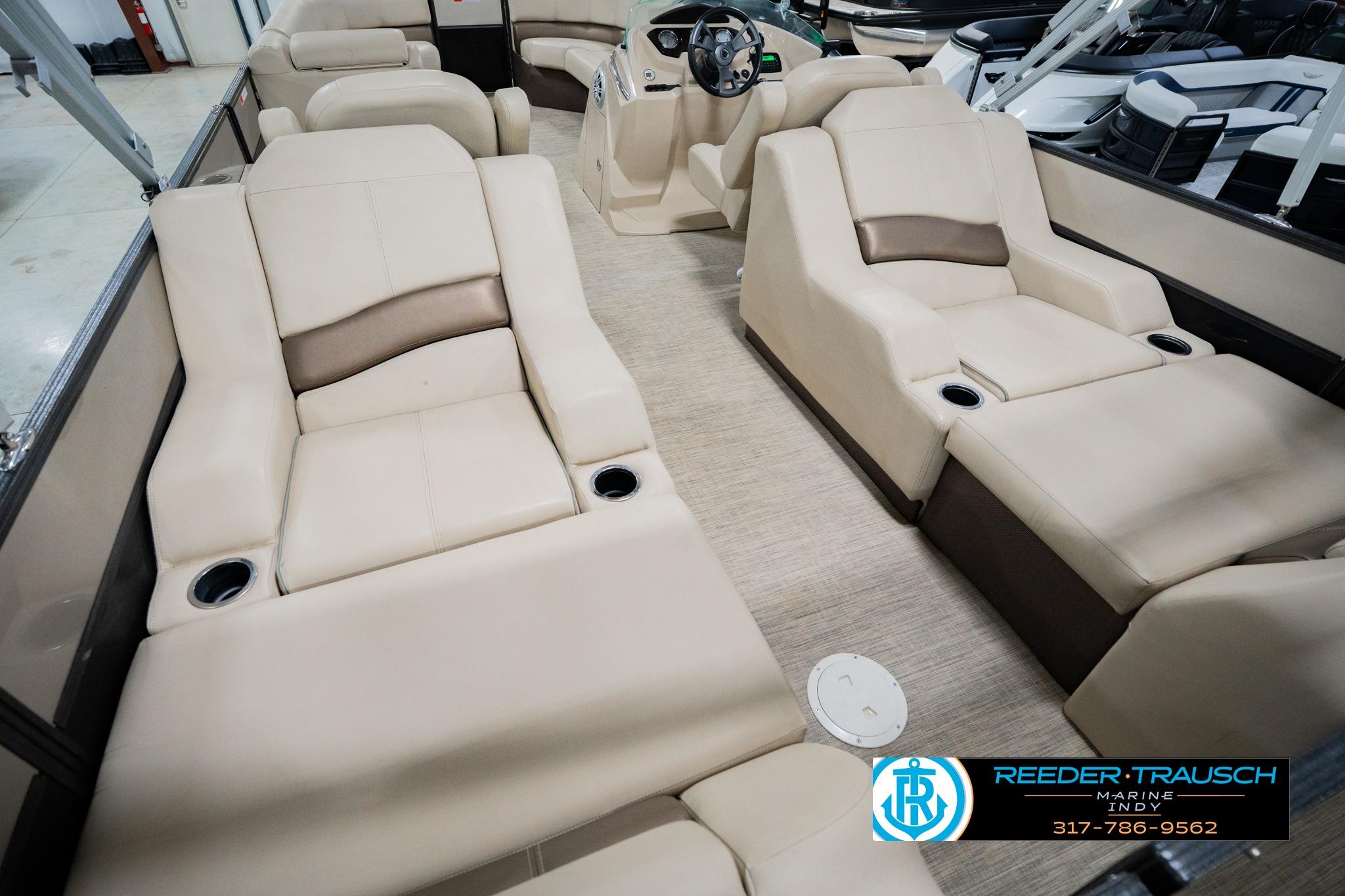 2016 Crest 250 SLR 2 boat interior with beige seating and steering console.