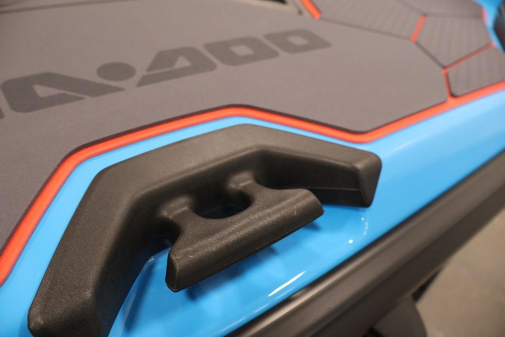 Close-up of 2026 Sea-Doo RXT-X 325 handle and deck design in blue and red.