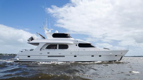 Grand Harbour 76 yacht cruising on open water, 2001 model.