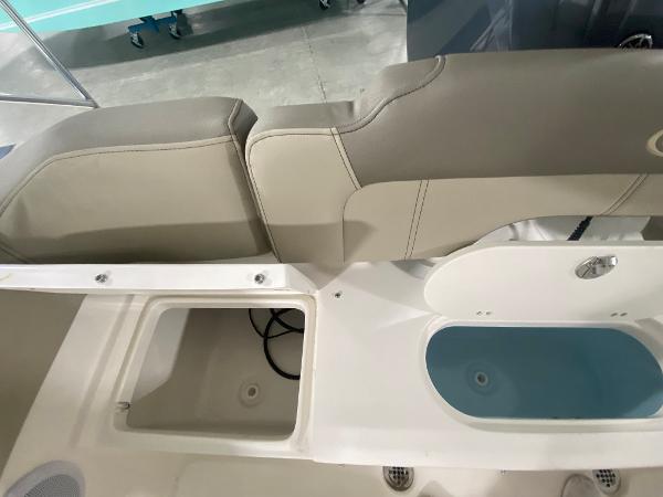 2024 Key West 203 FS boat interior with storage compartments and seating.
