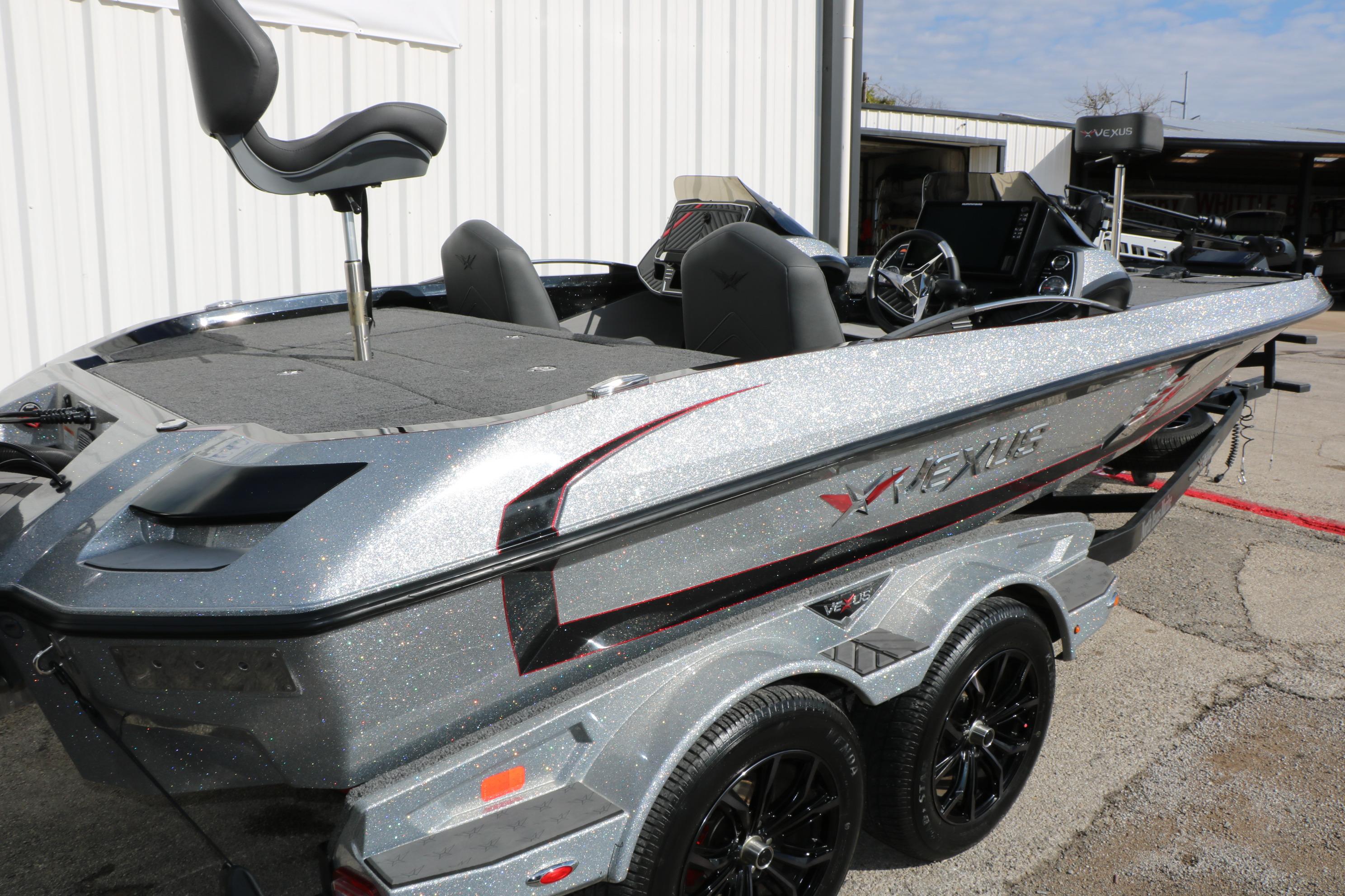 2022 Vexus VX21 boat with sleek design and metallic finish, parked outdoors.