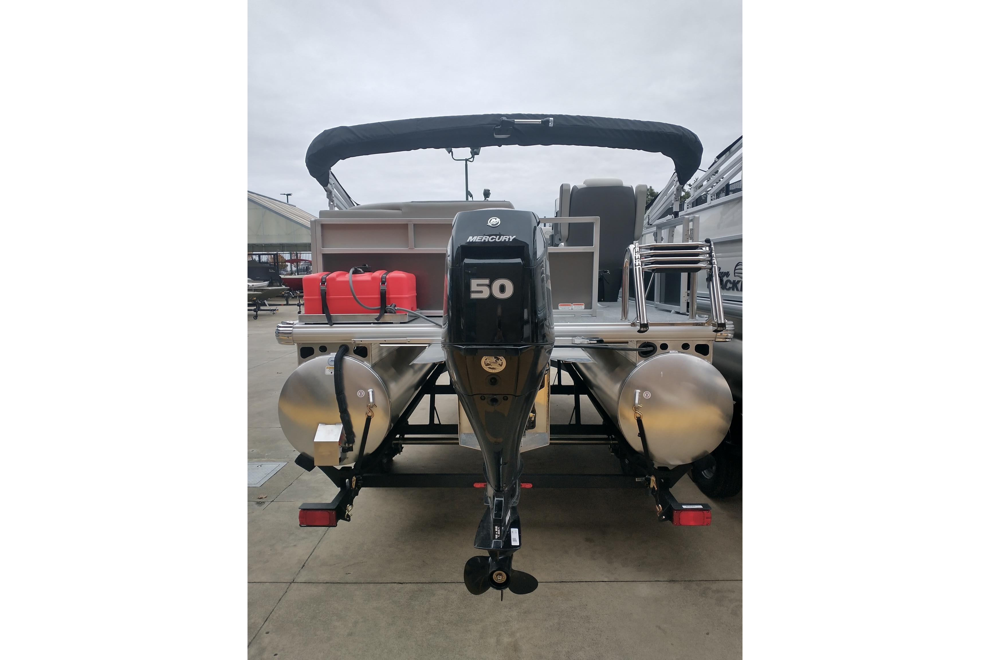 2026 Sun Tracker Bass Buggy 16 XL Select pontoon boat with Mercury 50 engine, rear view.