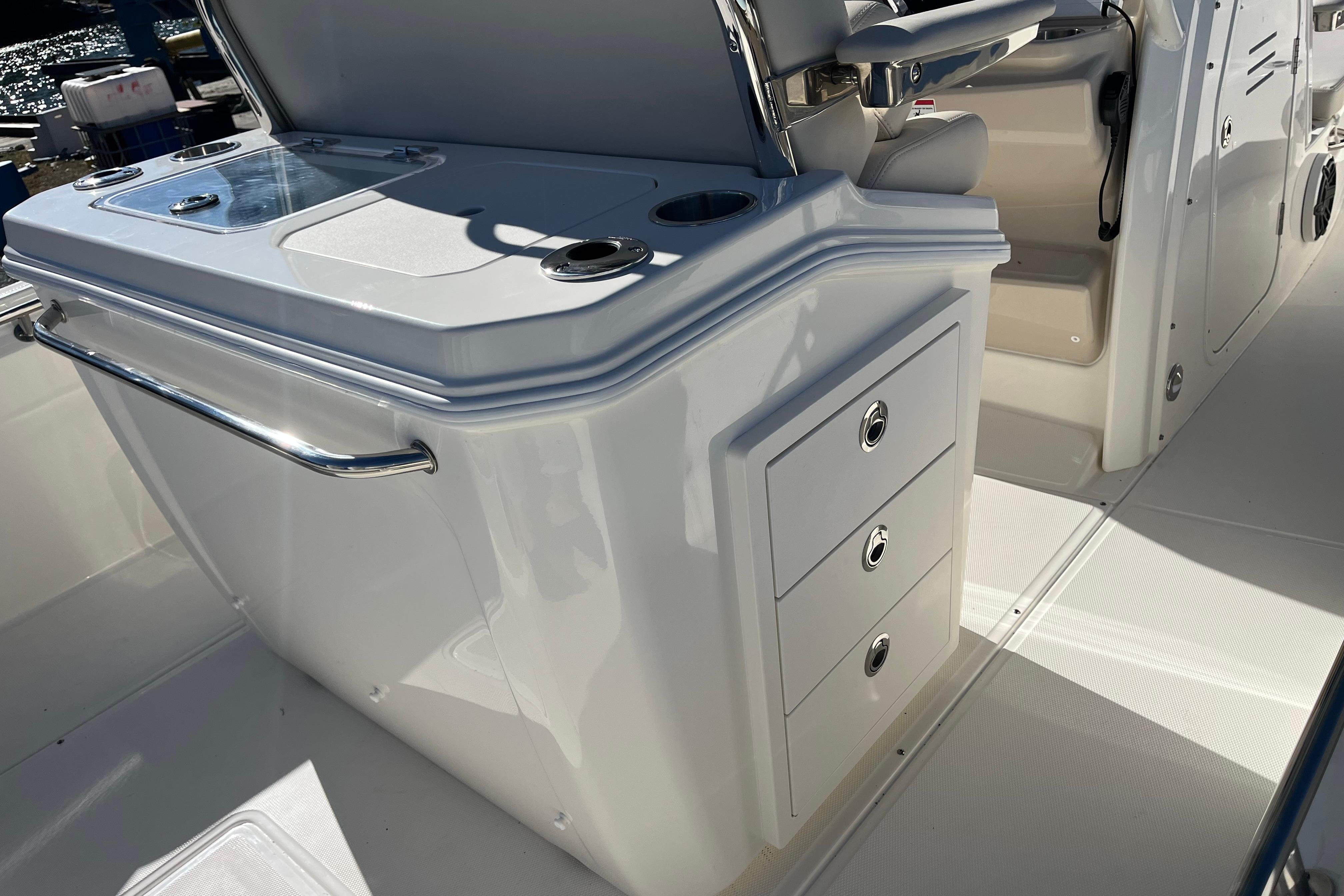 2026 Boston Whaler 280 Dauntless boat interior with storage drawers and seating.