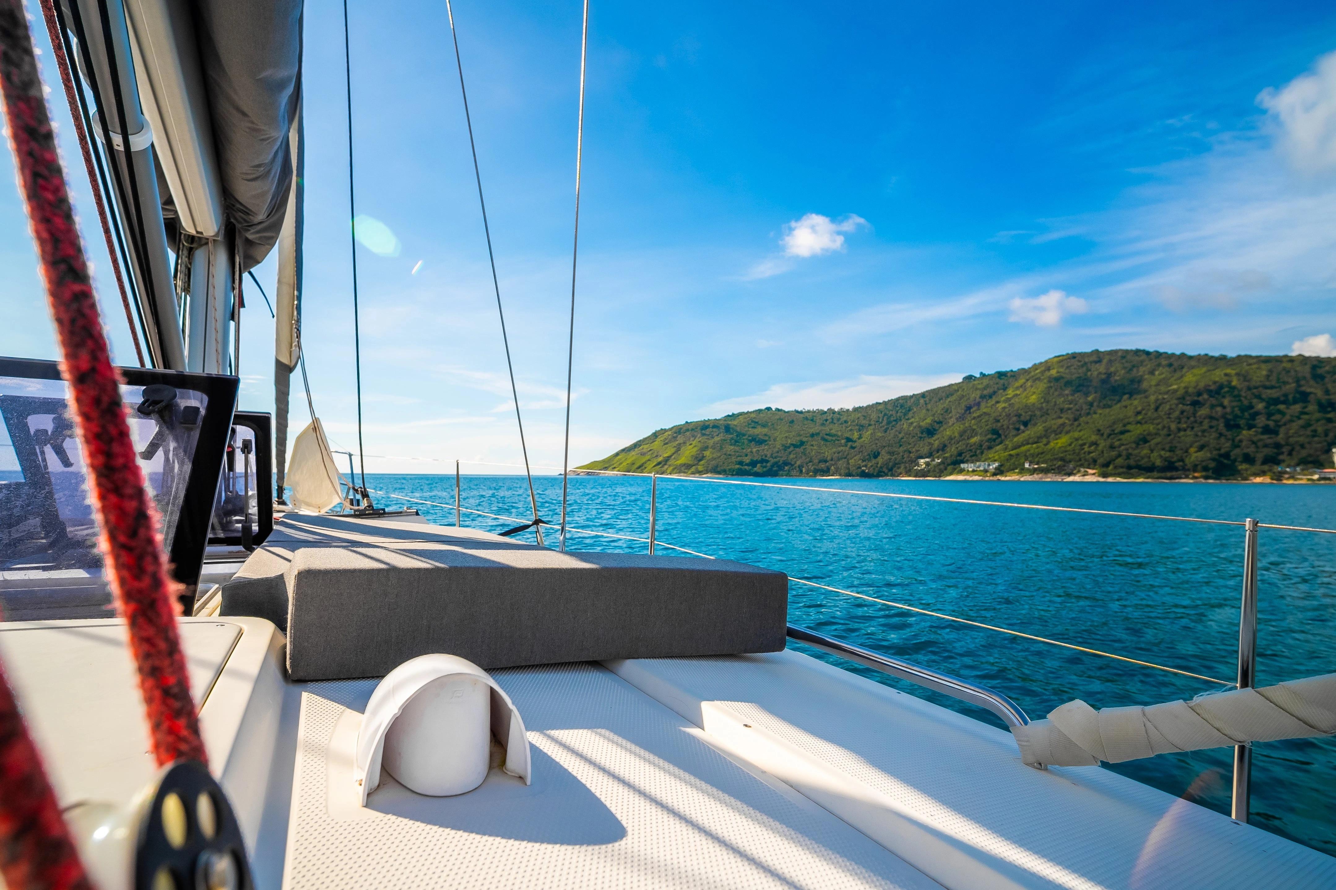 Sailing on a 2011 Hanse 400 yacht with scenic ocean and island views.