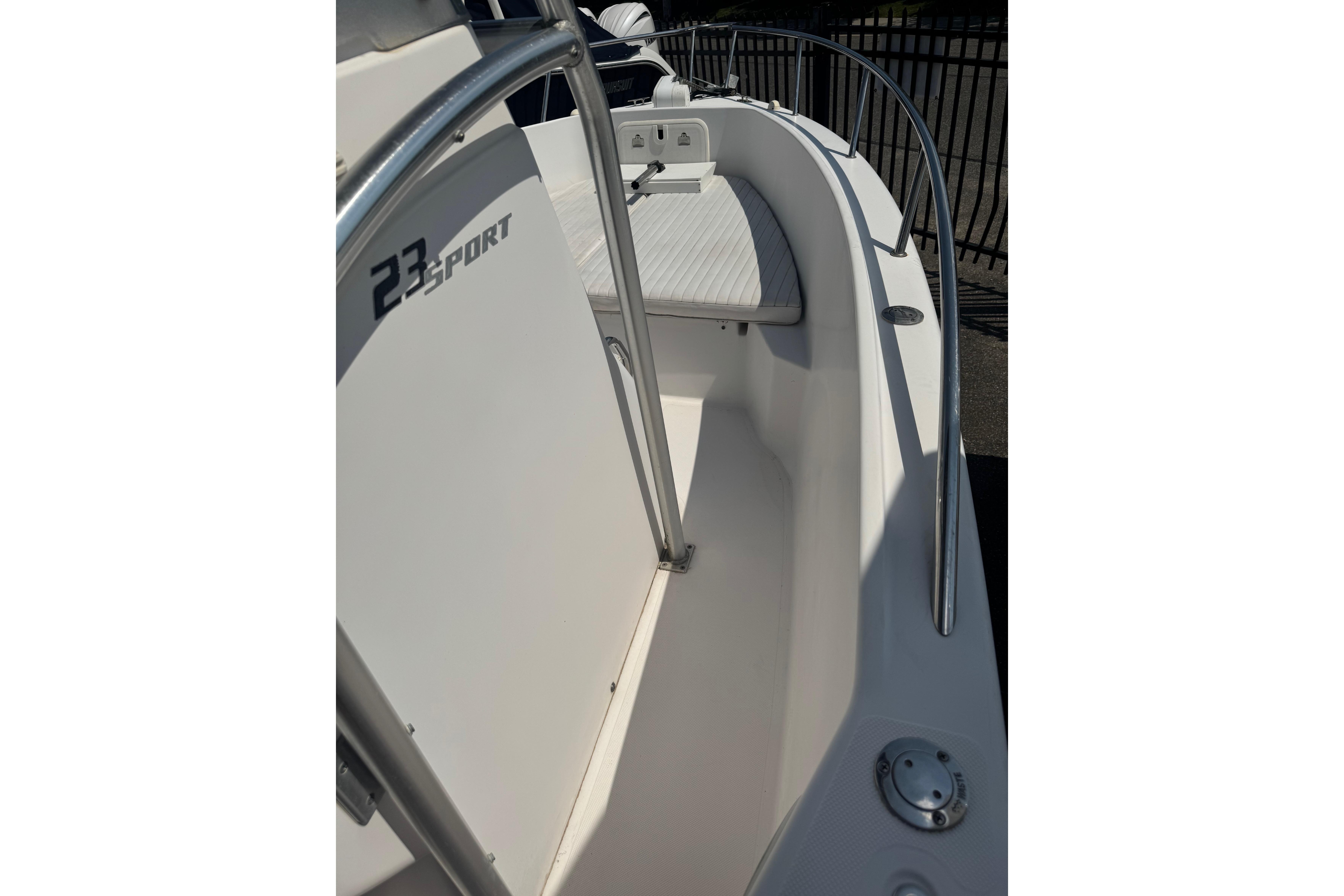 2002 Pro-Line 23 Sport boat interior with seating and railing.