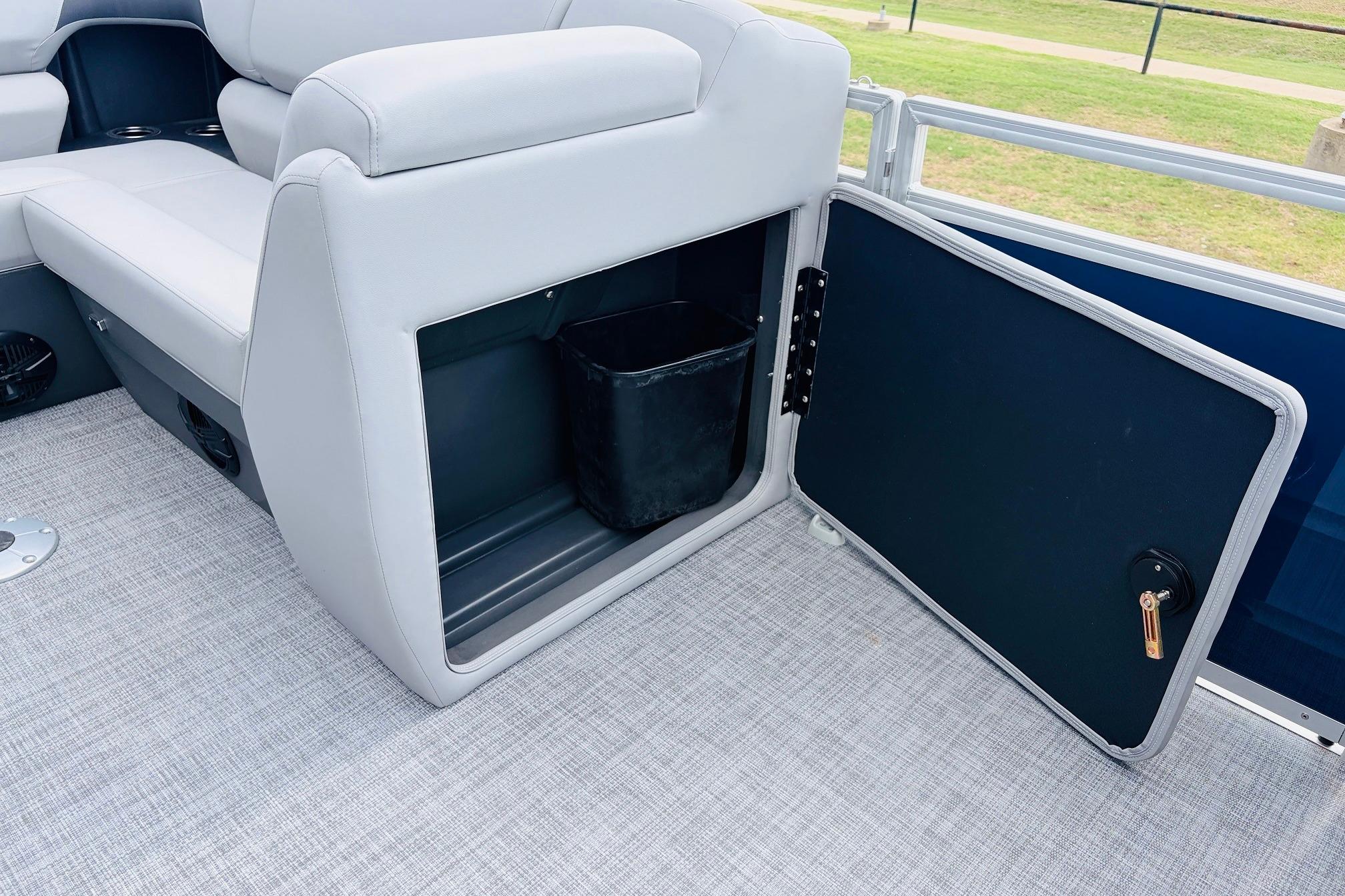 Interior storage compartment of 2026 Sun Tracker SportFish 22 DLX pontoon boat.