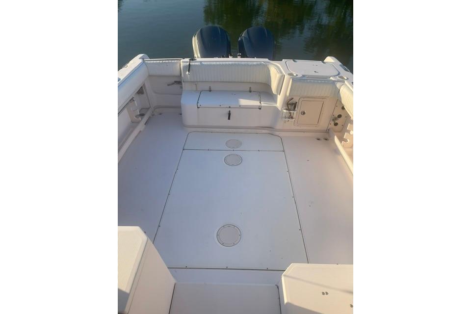 2002 Grady-White Marlin 300 boat deck with seating and storage compartments.