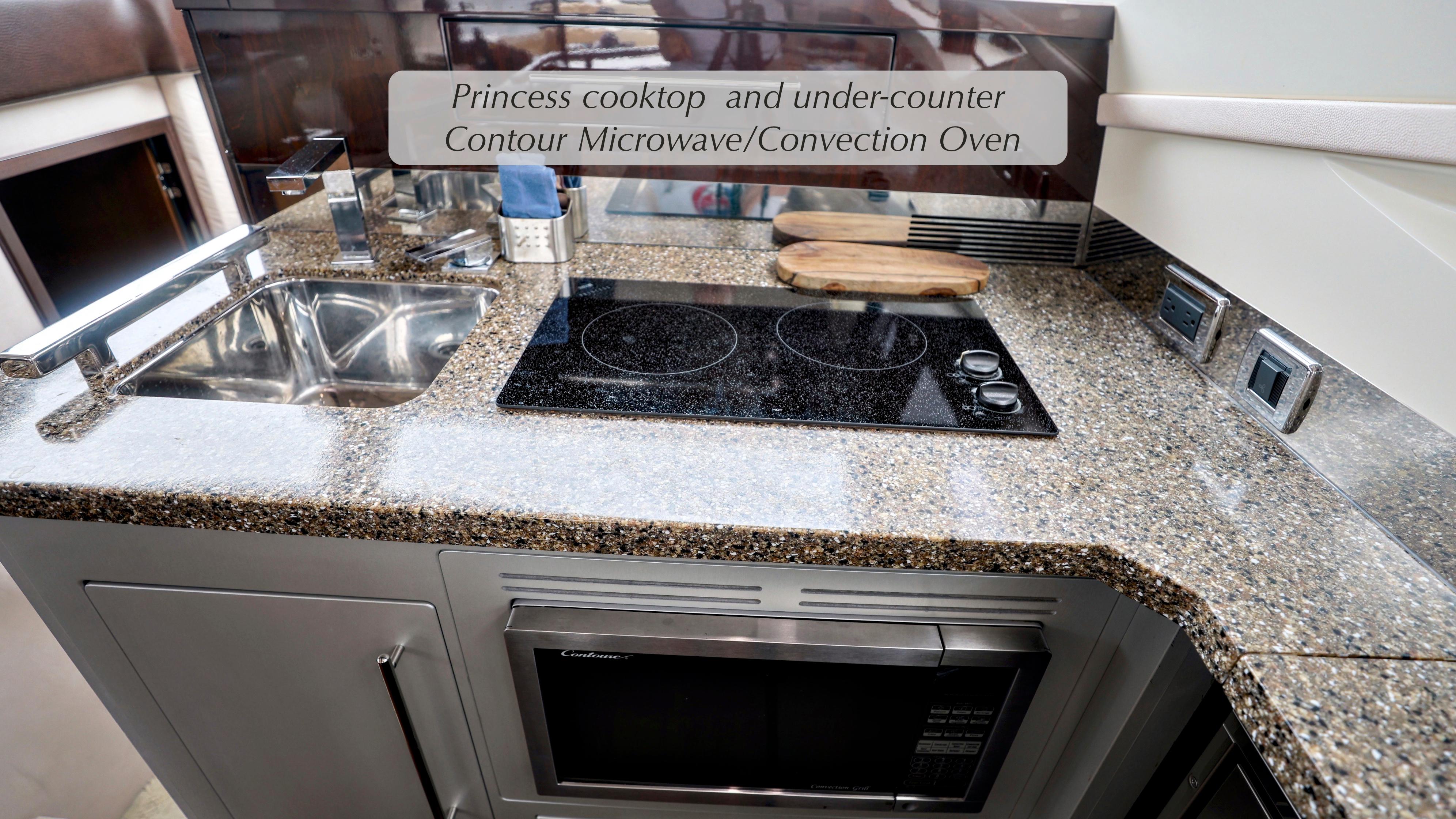 Luxurious kitchen in 2013 Marquis 500 Sport Bridge with cooktop and microwave.