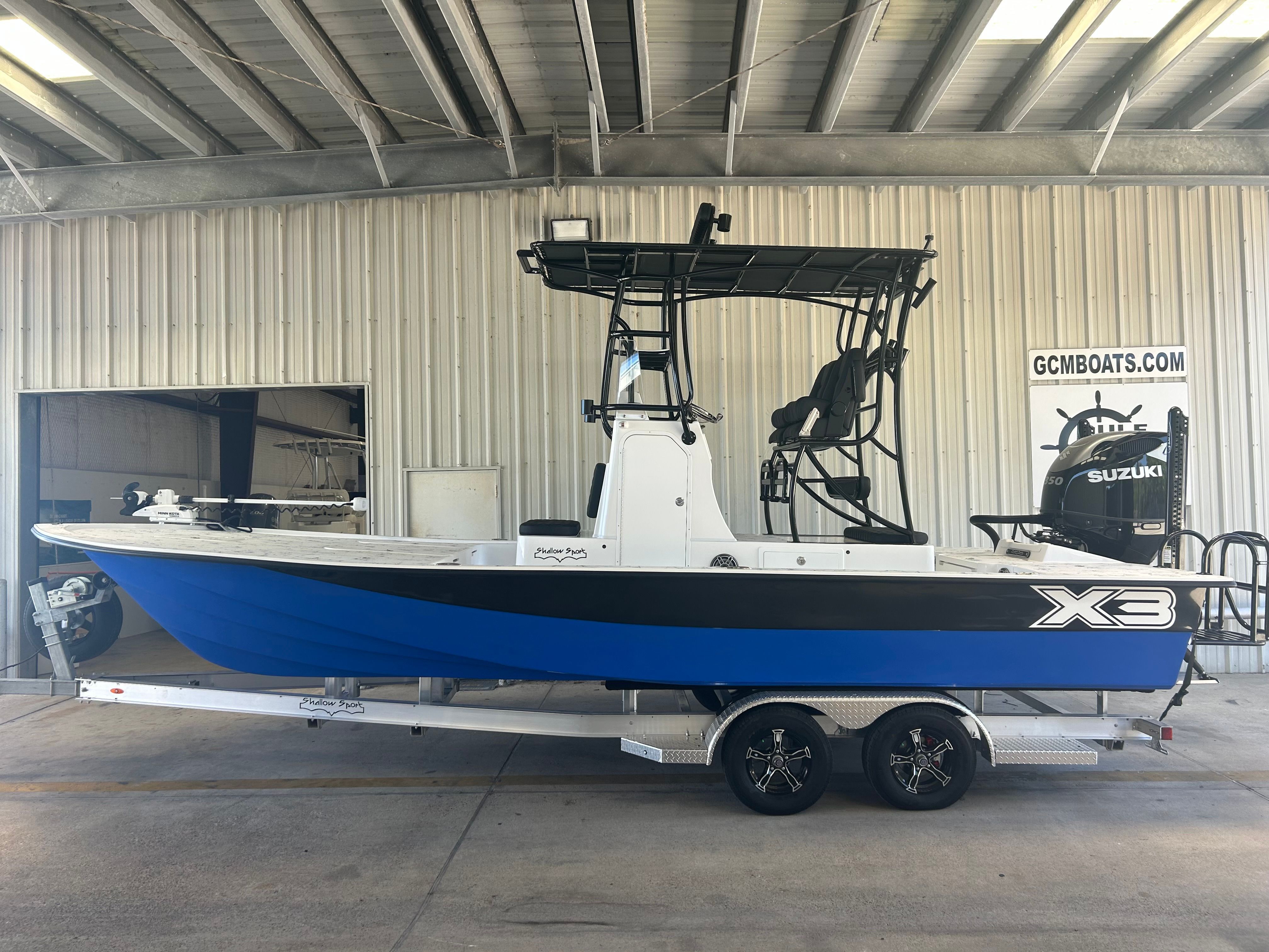 2023 Shallow Sport 25 X3 boat in a warehouse.