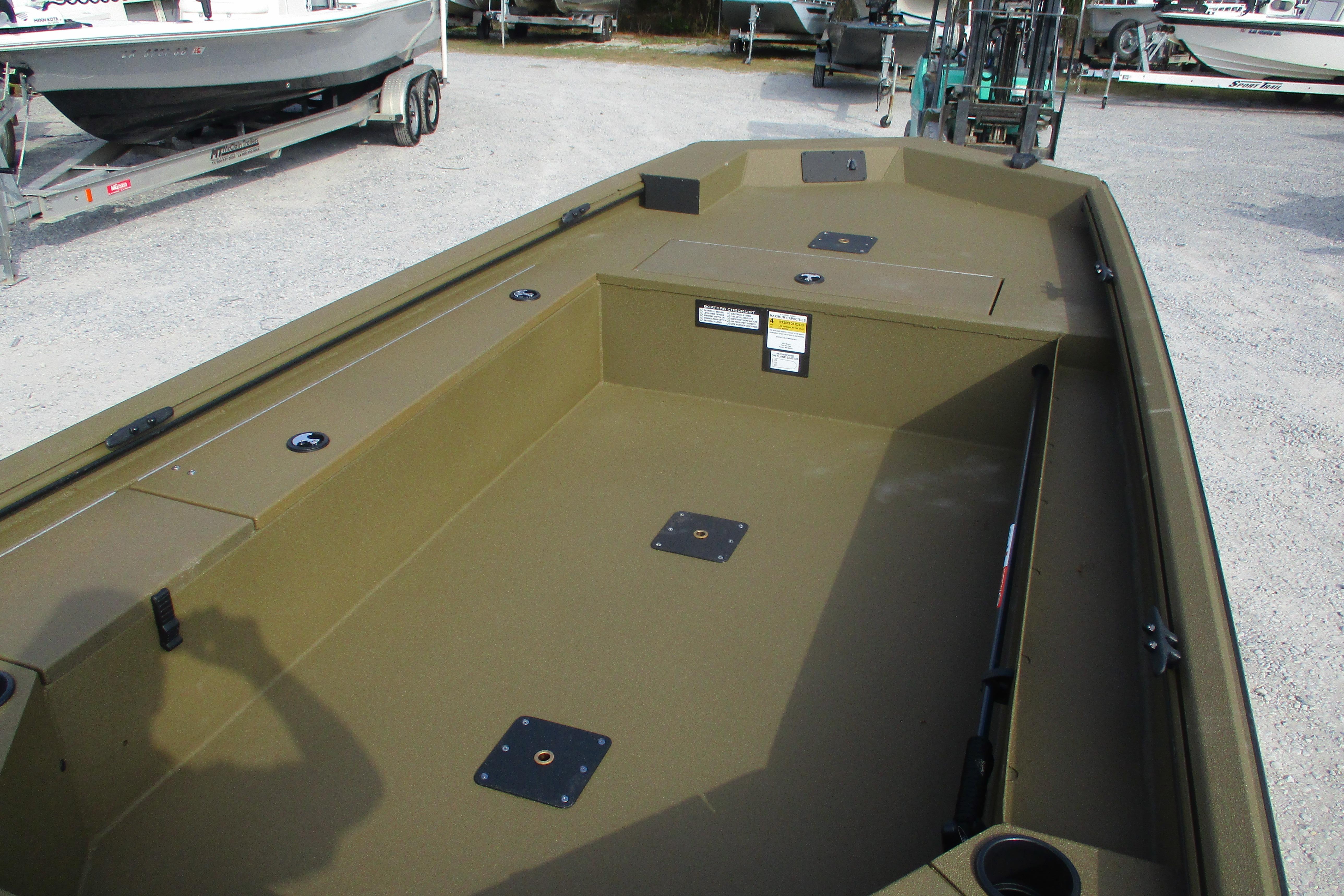 2026 Avid 16 Commander boat interior with spacious deck and storage compartments.