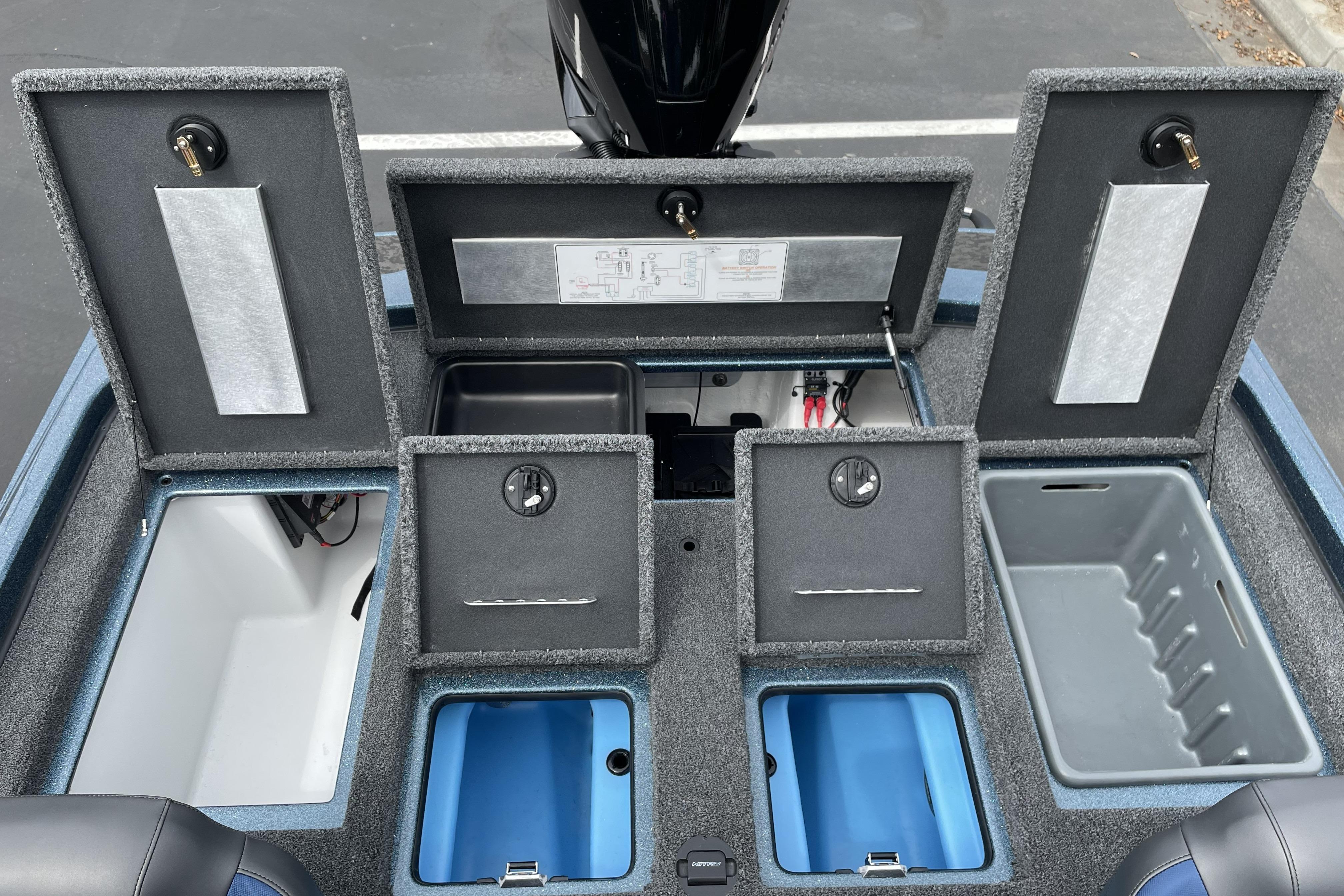 2026 Nitro Z21 XL boat storage compartments with open lids, showcasing organized interior layout.