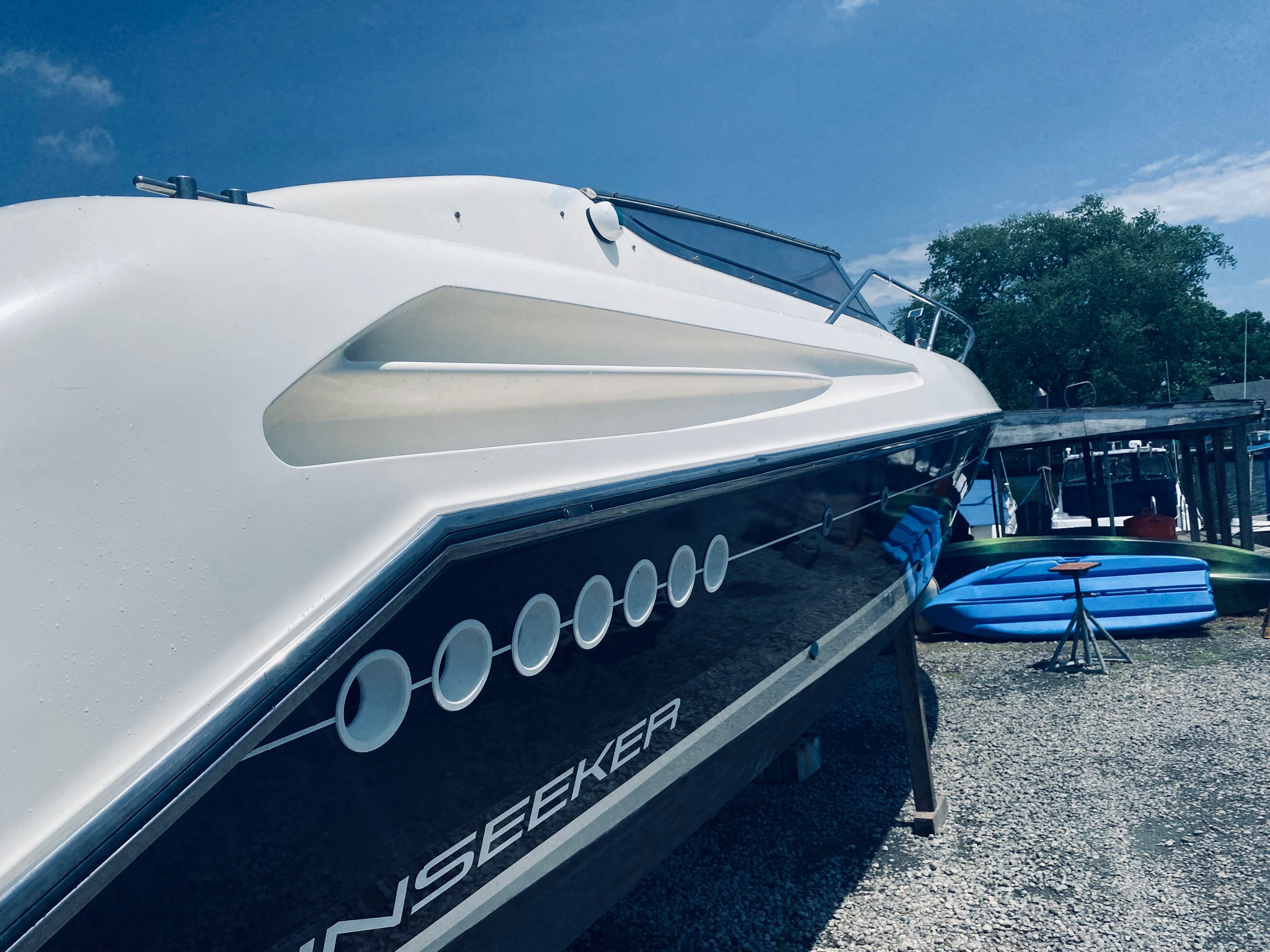 1994 Sunseeker Hawk 31 boat on gravel lot.