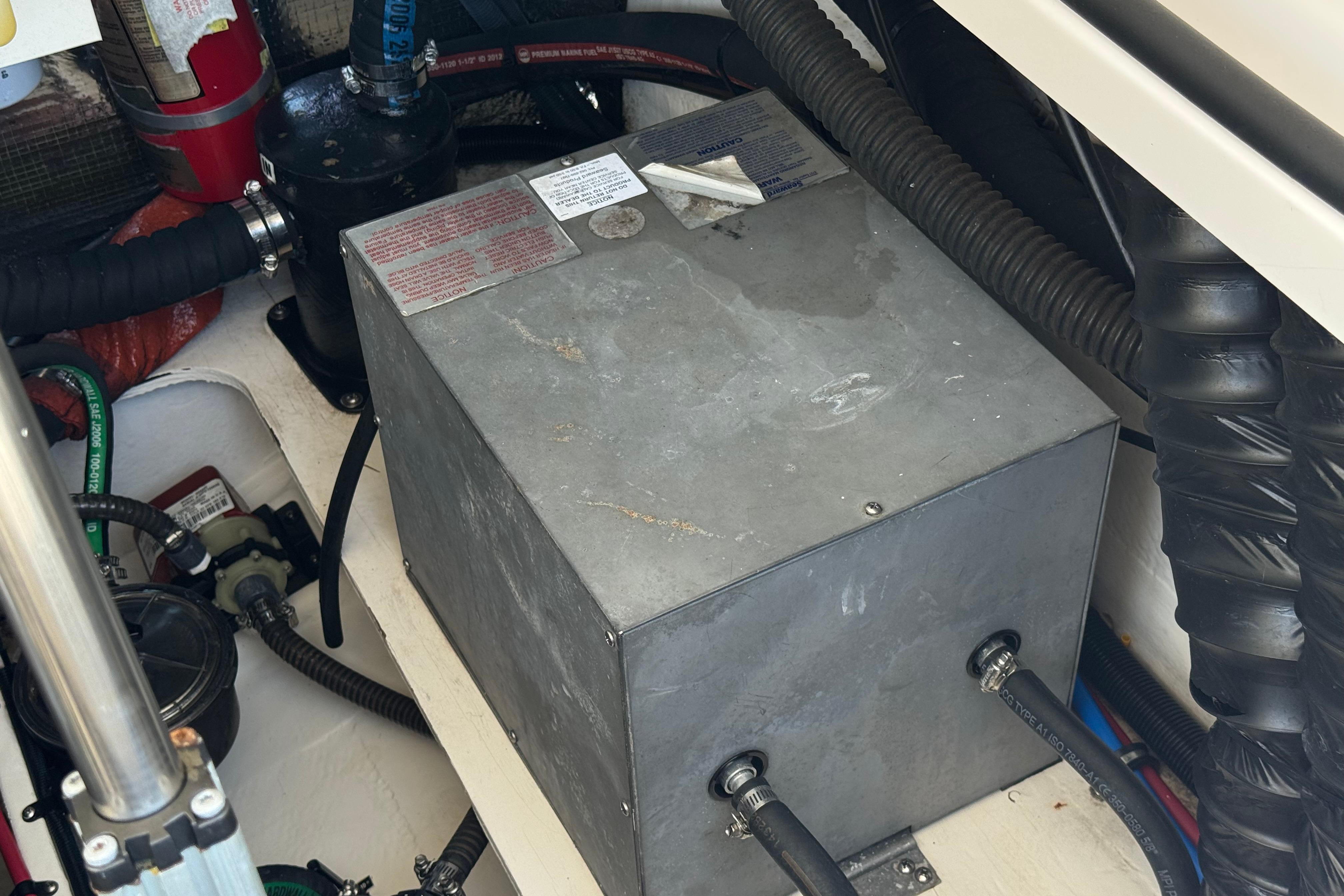 Engine compartment of a 2013 Regal 28 Express boat with mechanical components.