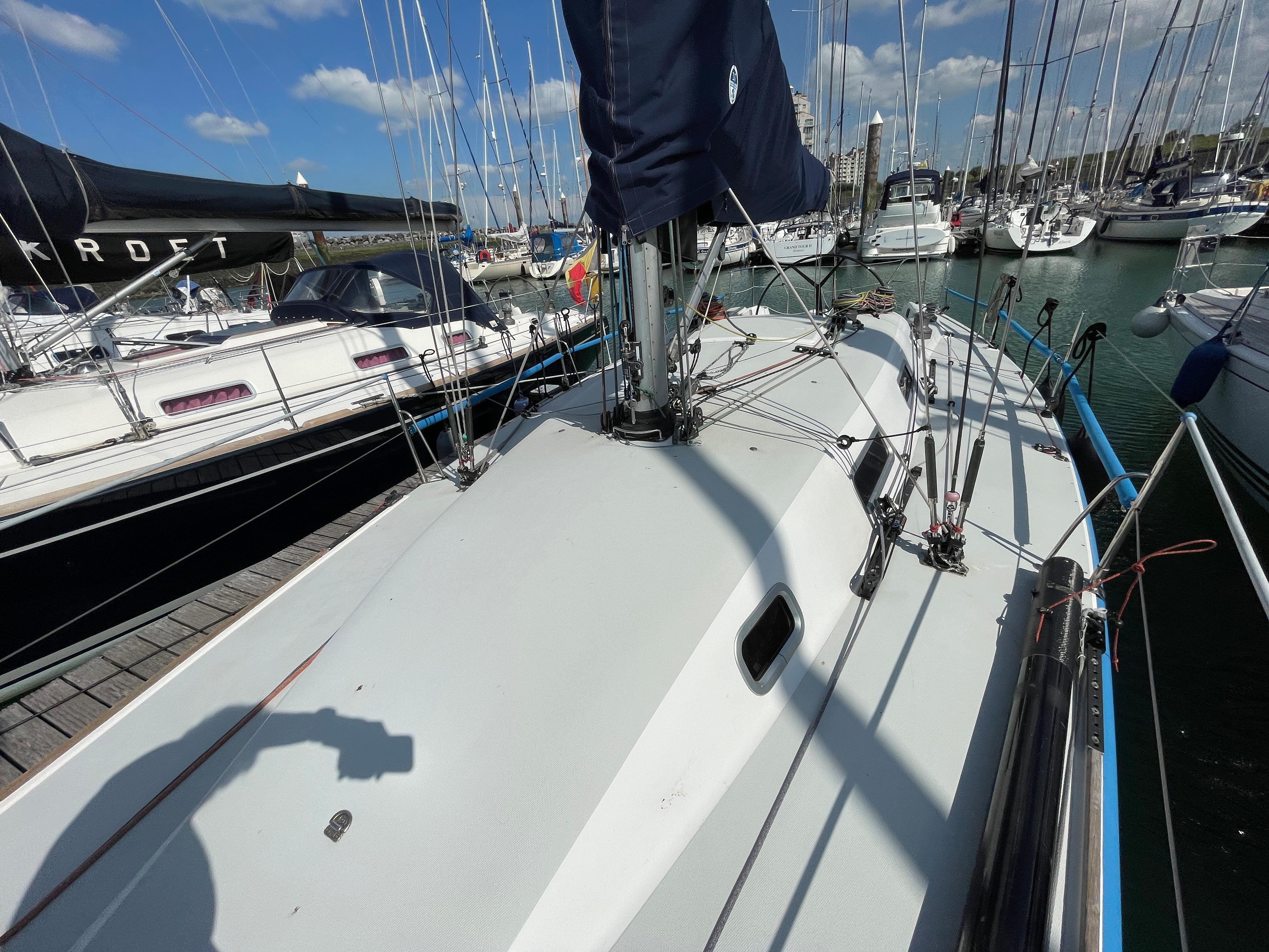 Sailboat deck view of 1995 Boatyard Bashford Howinson 41 in marina.