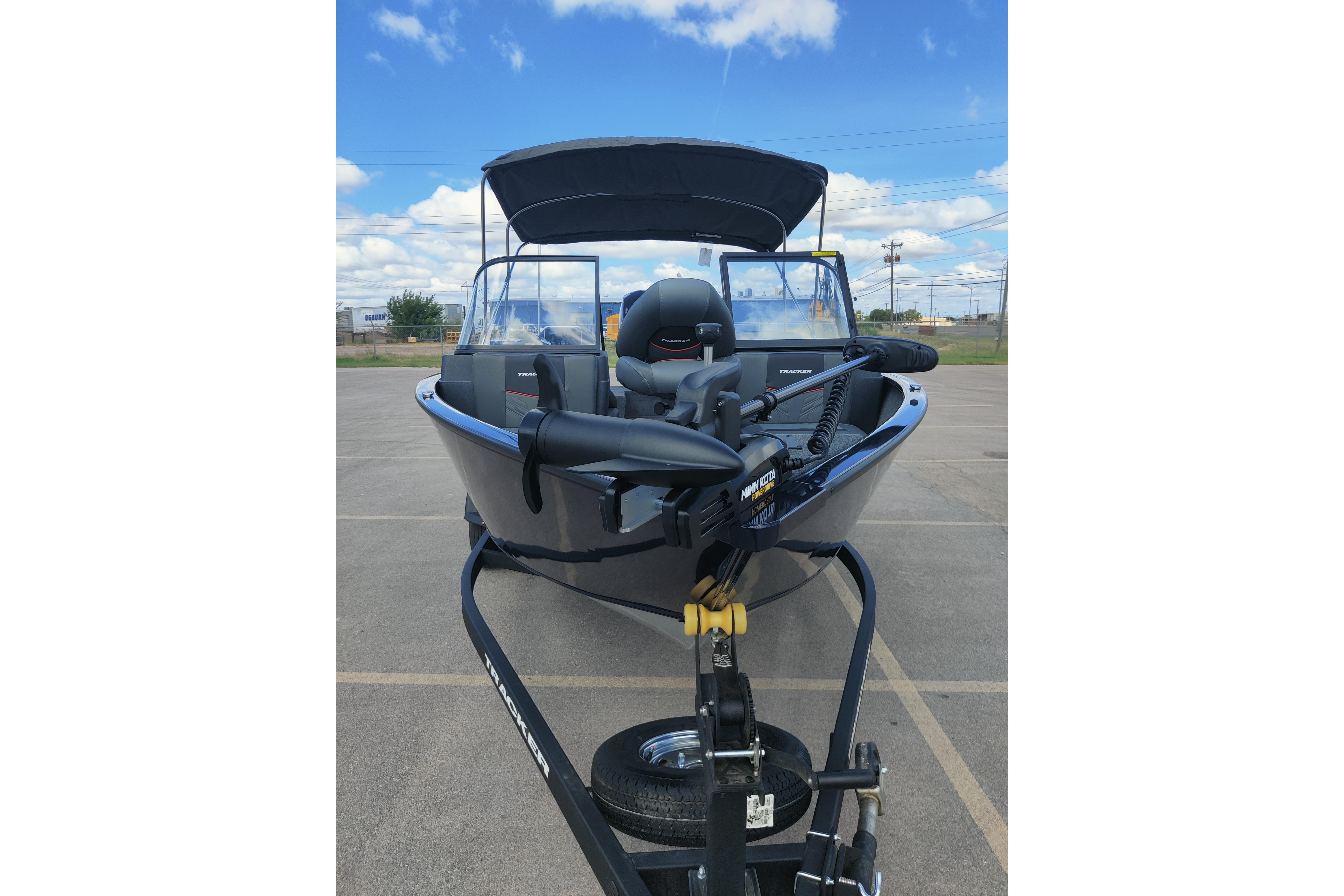 2026 Tracker Pro Guide V-175 Combo boat on trailer, parked outdoors under blue sky.