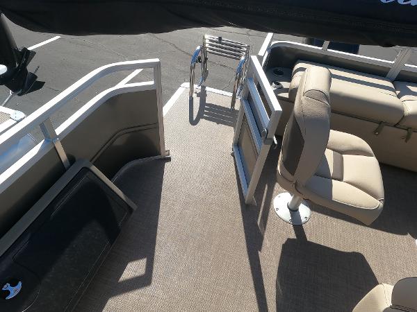 2024 Sun Tracker Fishin' Barge 22 XP3 interior with seating and entry gate.