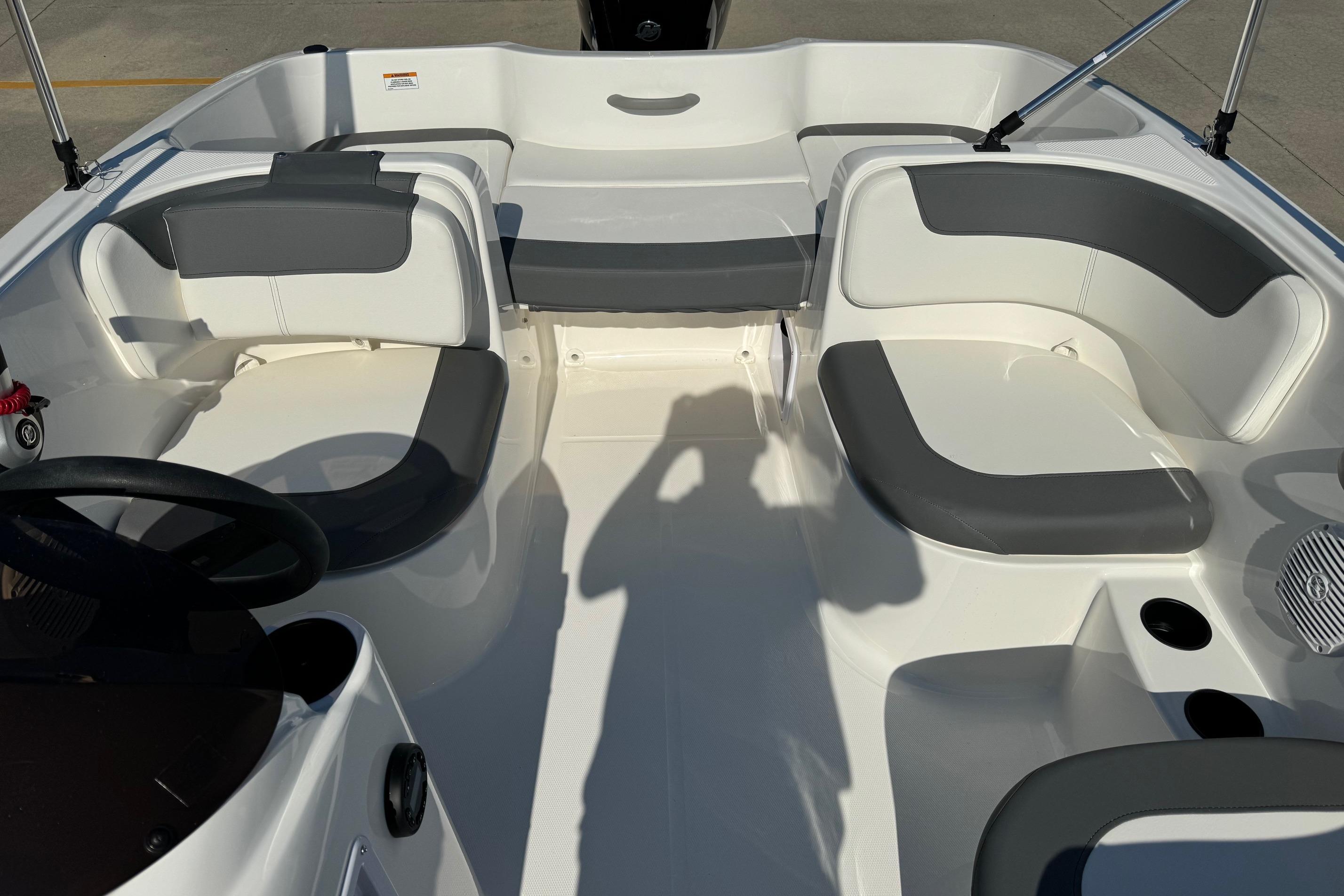 2025 Bayliner Element E16 boat interior with gray and white seating arrangement.