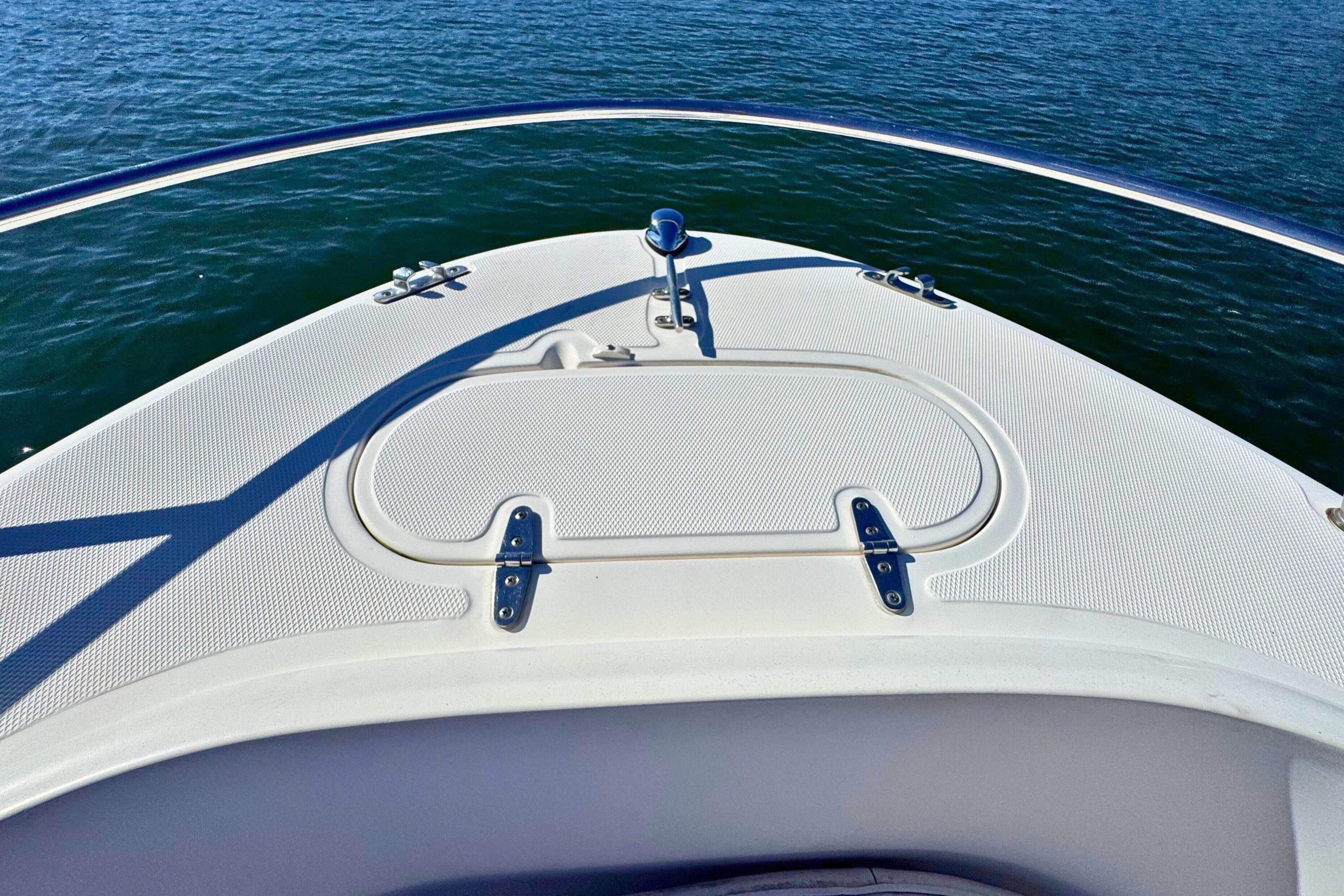 Bow of 2002 Sea Hunt Escape 200 boat on calm water.