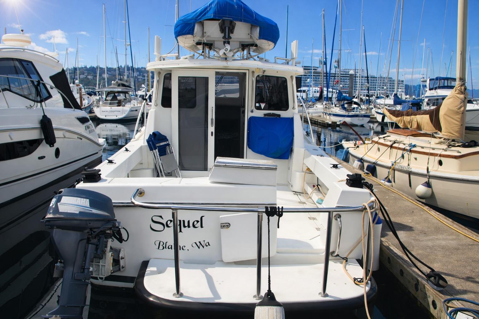2005 Ocean Sport 30' boat docked at marina, surrounded by other vessels.