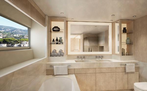 Modern bathroom with double sinks, large mirror, and scenic window view in Project Abacos, 2025.