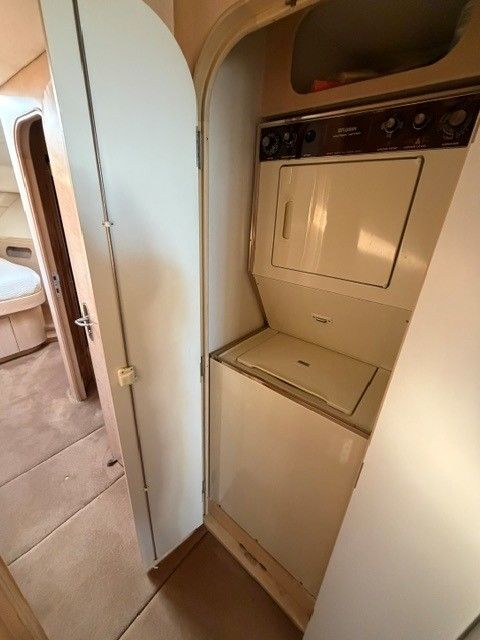 Washer and dryer inside a 1990 custom motor yacht.