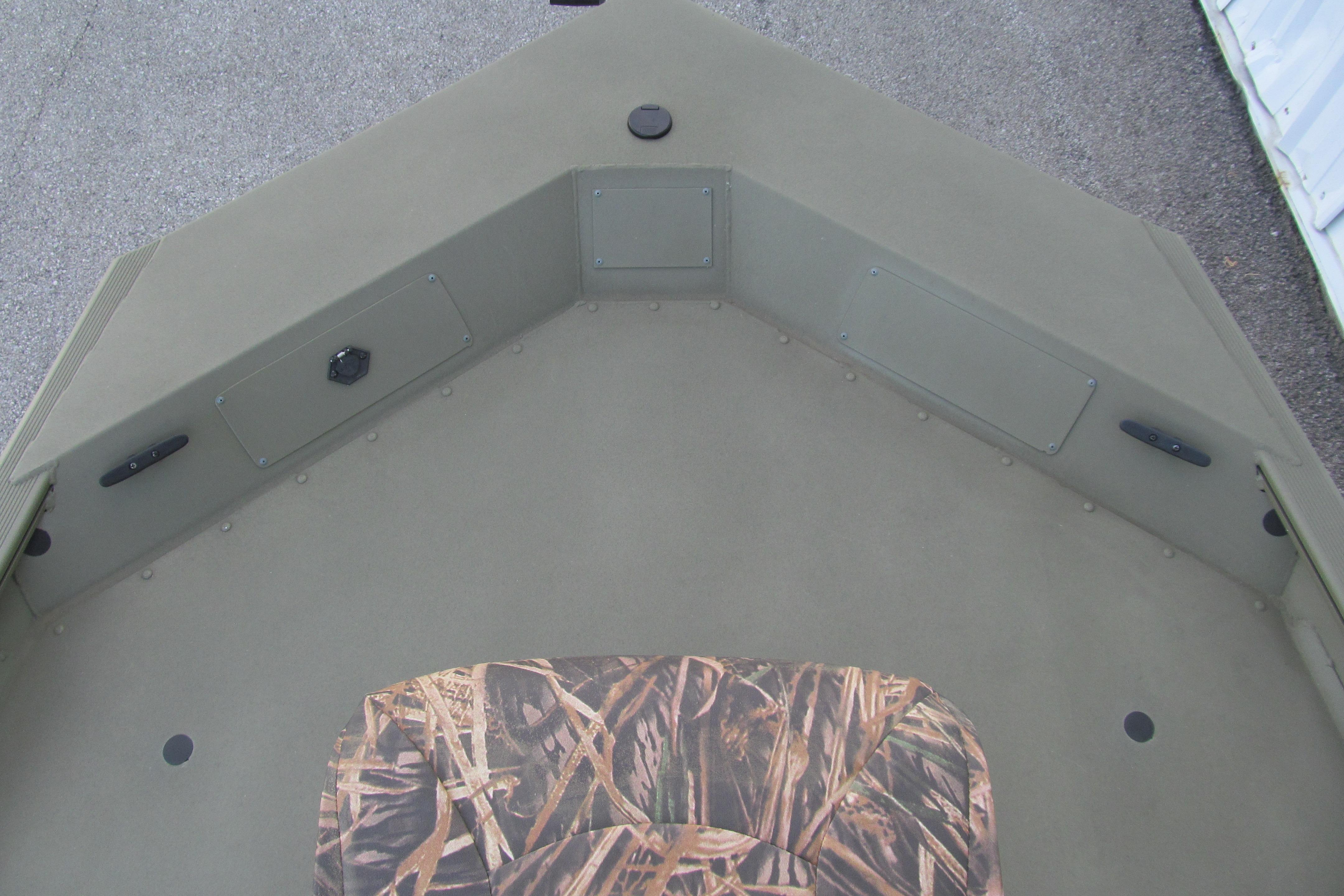 2018 Tracker Grizzly 1754 SC boat interior with camouflage seat and storage compartments.