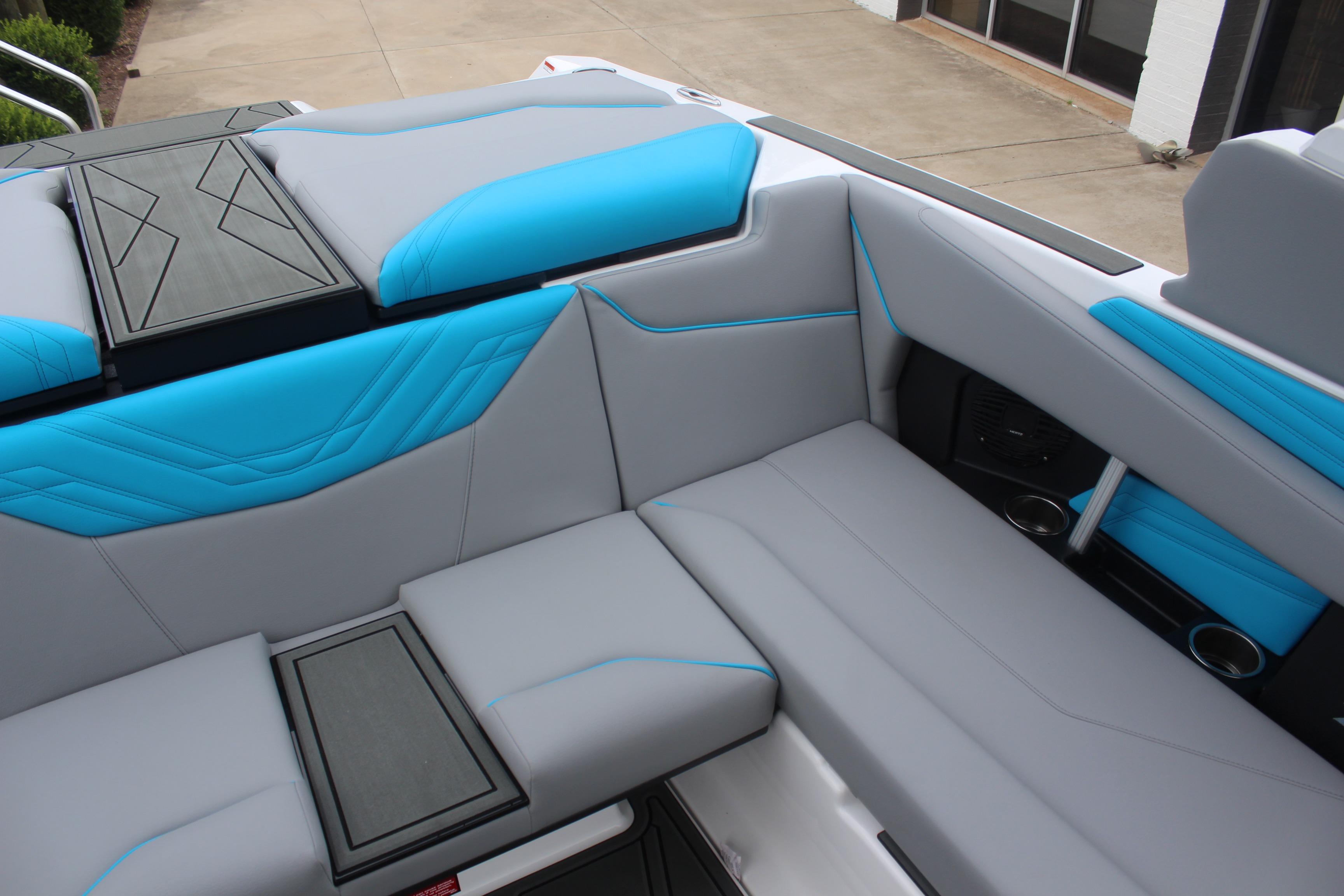 2026 ATX Surf Boats 22 Type-S interior with gray and blue seating, modern design.