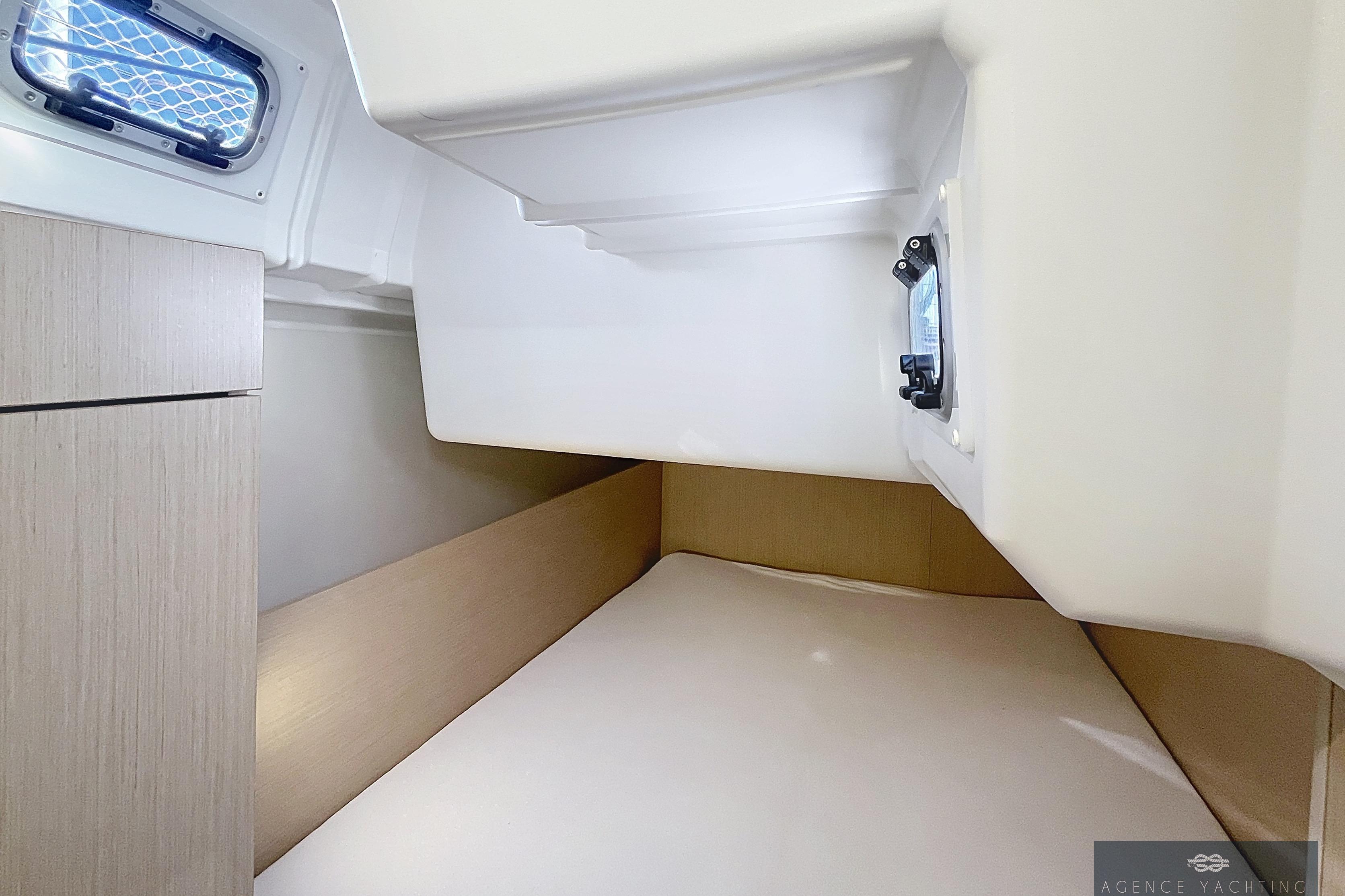 Interior cabin of 2020 Beneteau Oceanis 35.1 yacht, featuring a cozy sleeping area.