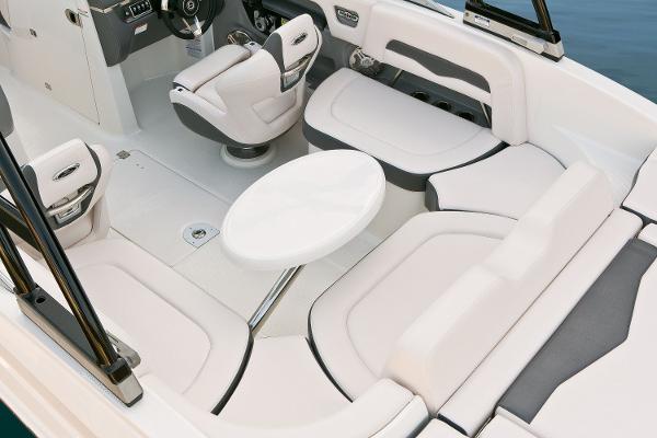 Manufacturer Provided Image: 2016 Chaparral 246 SSi boat interior with white seating and round table.