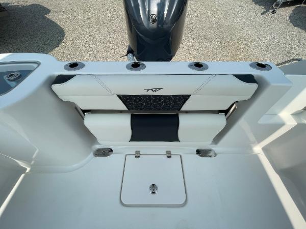 2025 Tidewater 232 CC Adventure boat interior with seating and storage compartments.