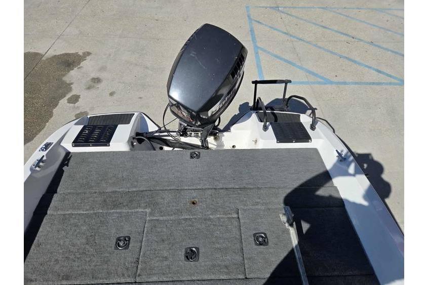 1997 Javelin 389 FS boat with outboard motor and carpeted deck.