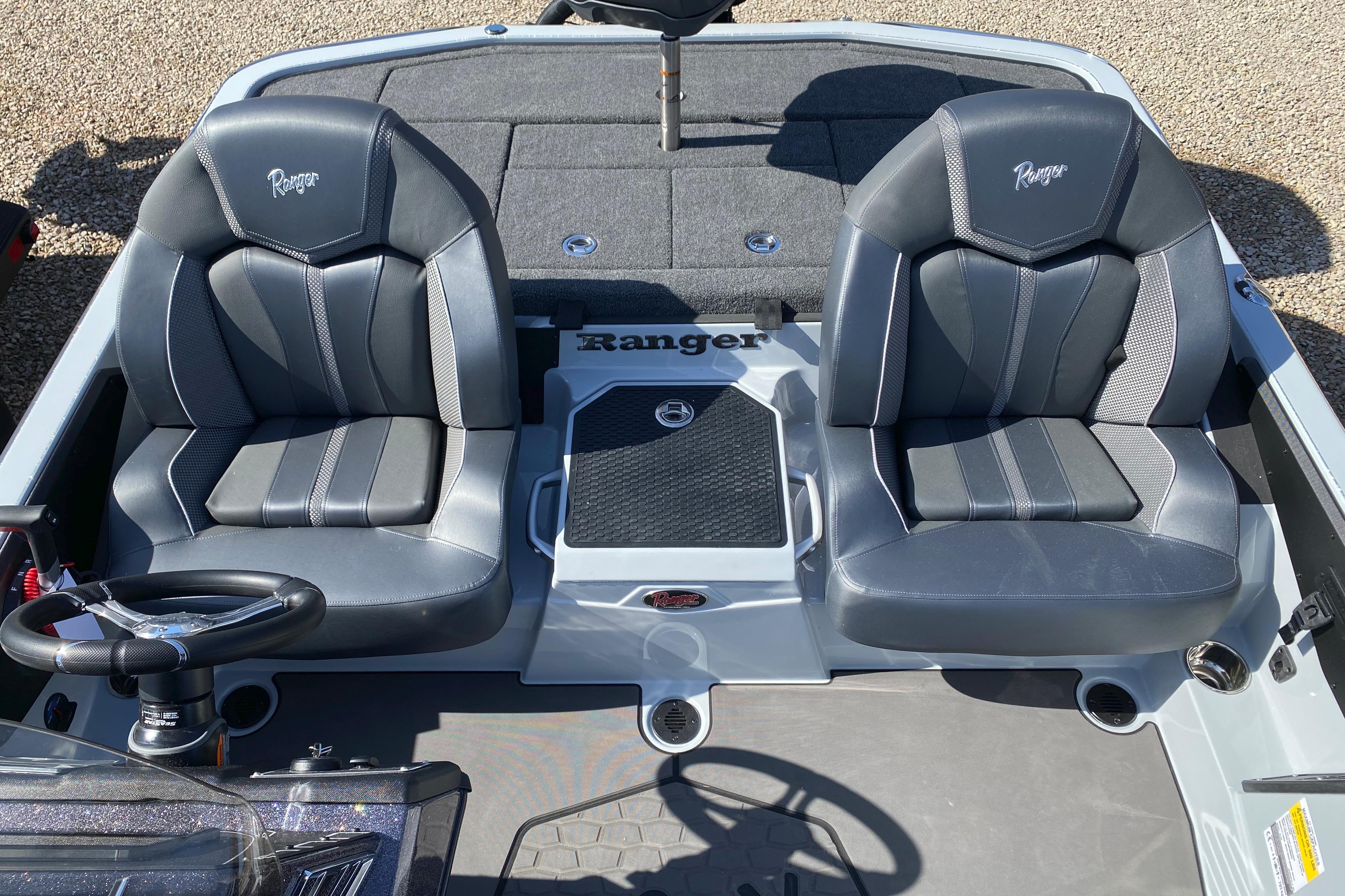 2026 Ranger Z519R boat interior with dual gray seats and steering wheel.