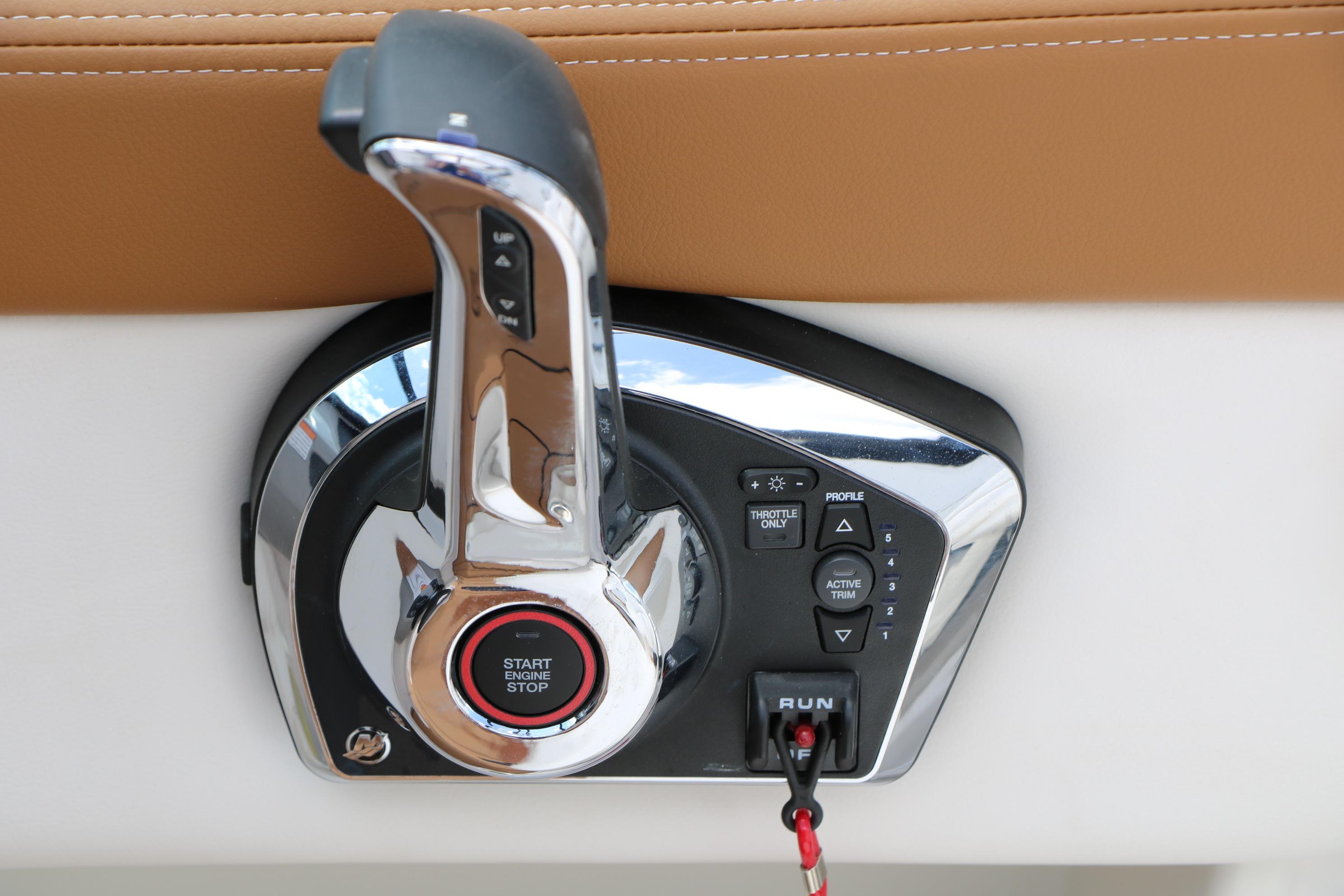 Throttle control panel of 2025 Chaparral 23 SSi boat with start-stop button.