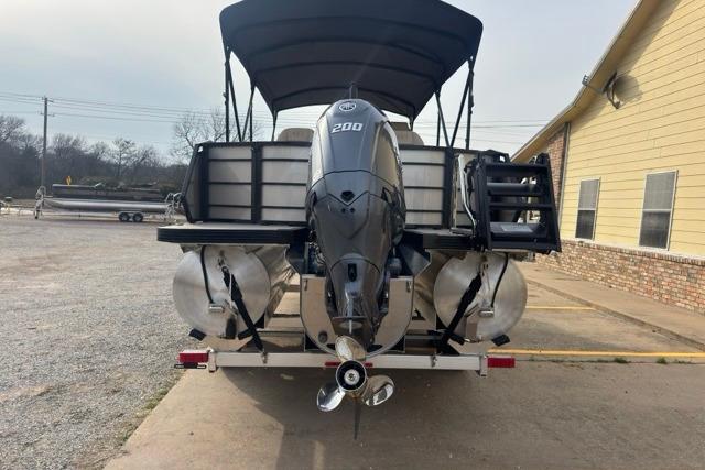 2026 Veranda VR235F2 pontoon boat with powerful 200 HP engine, parked outdoors.