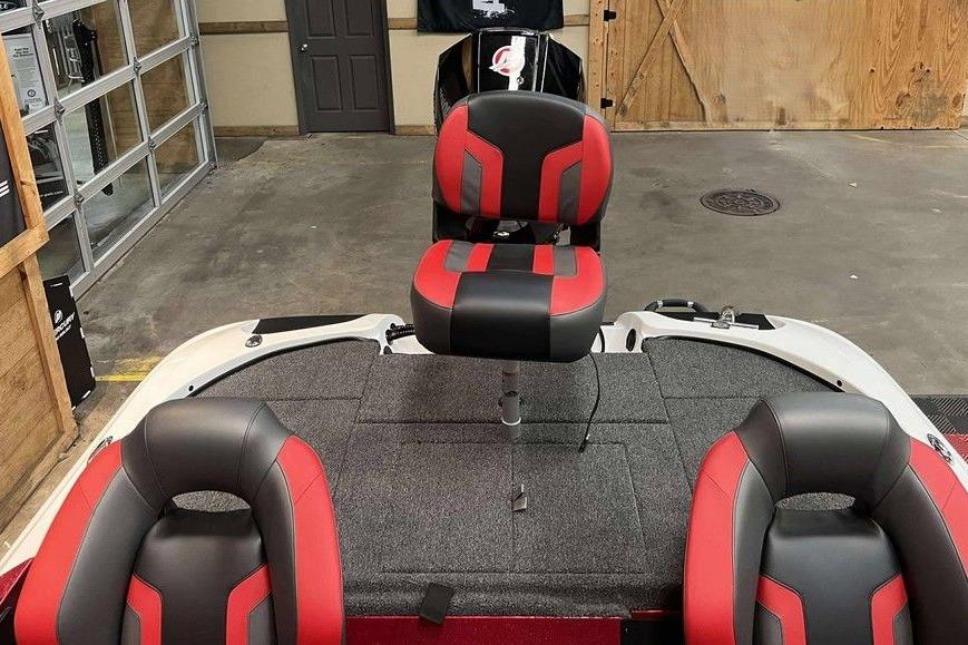 Red and black seats on a 2026 Nitro Z18 Pro boat in a garage.