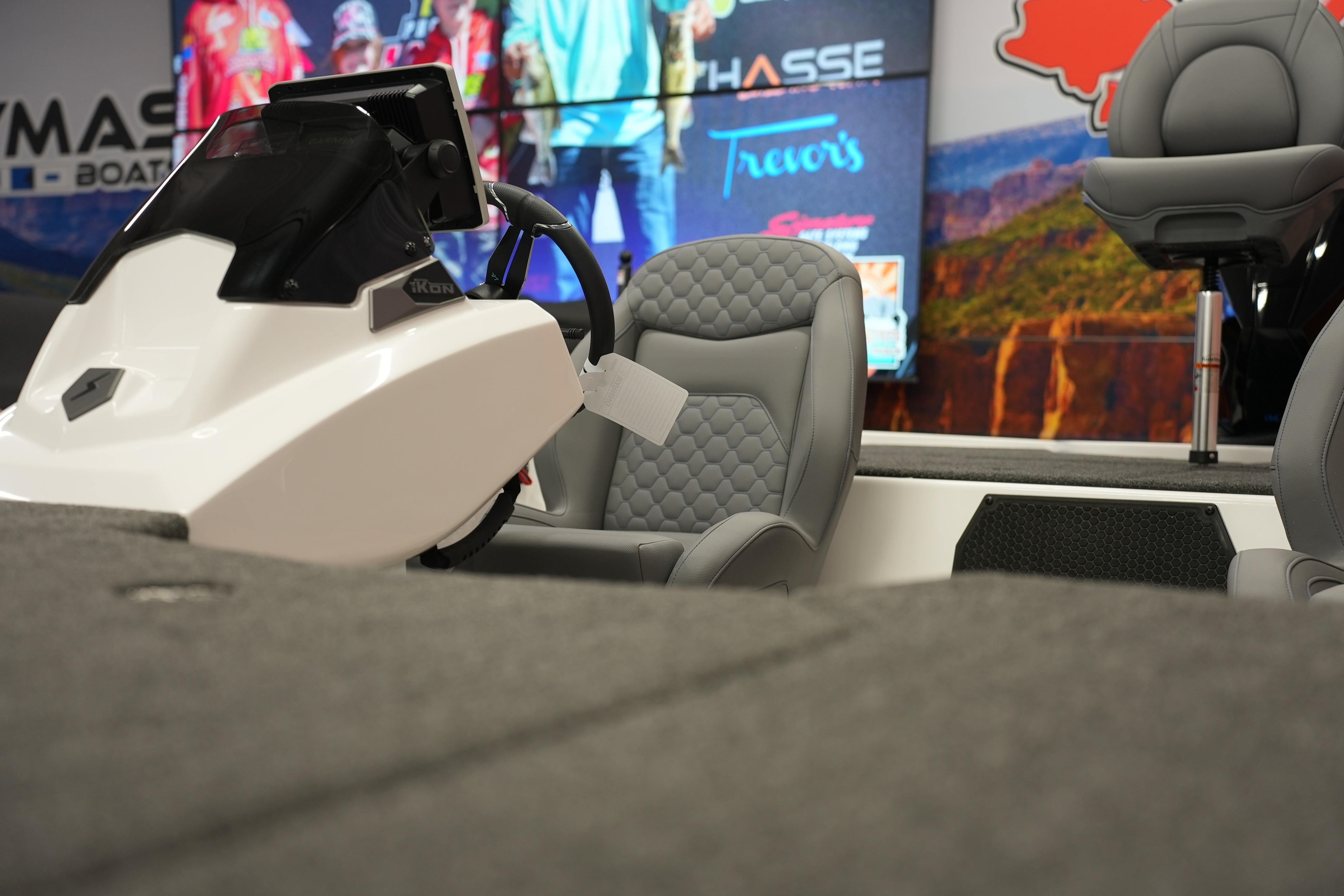 Interior of 2026 iKon VLE21 boat with modern steering and comfortable seating.