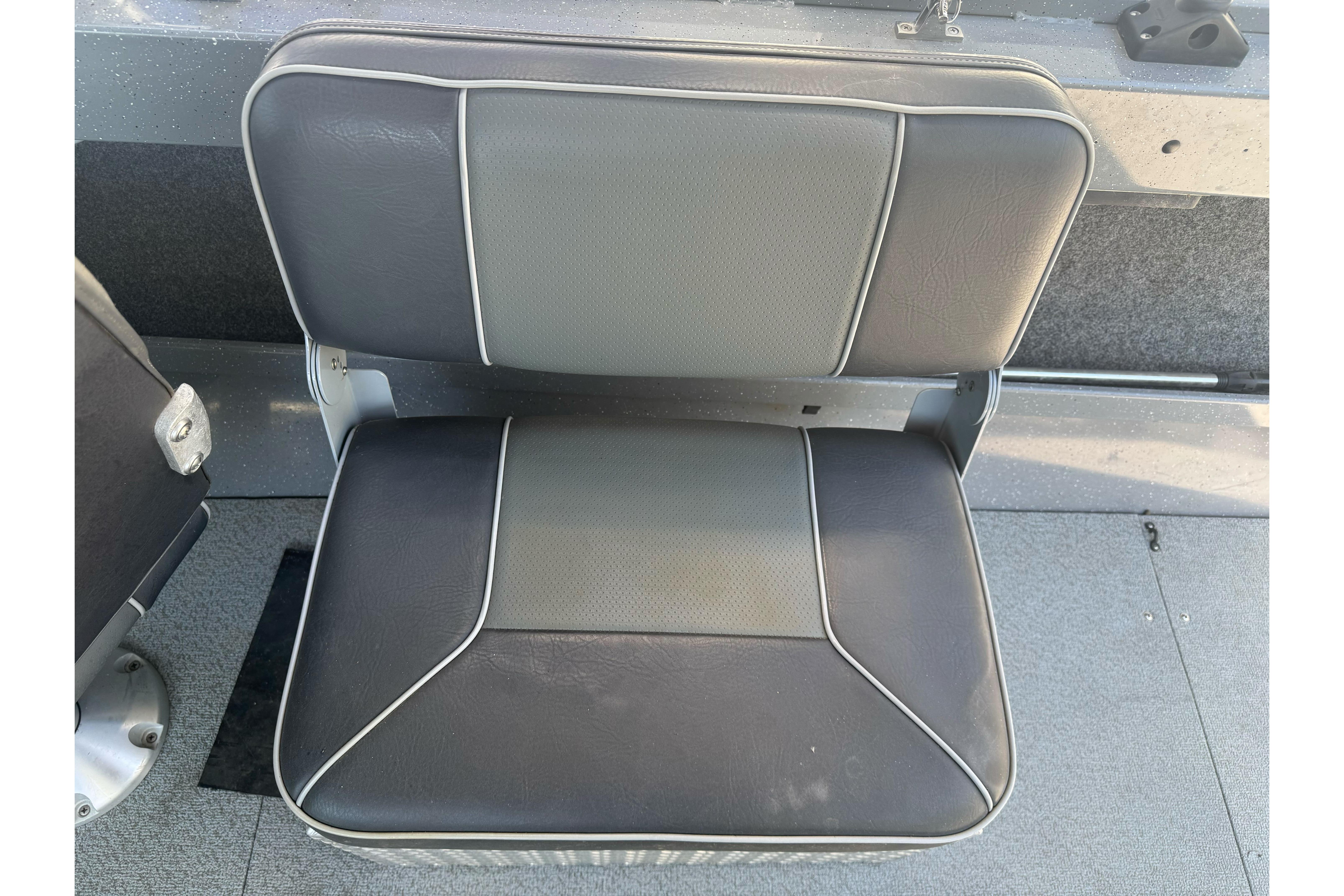 Gray and black boat seat in a 2014 River Hawk 19 GB model.