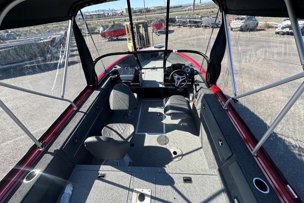 Interior view of 2026 Starweld 17 SXT boat with seating and steering console.